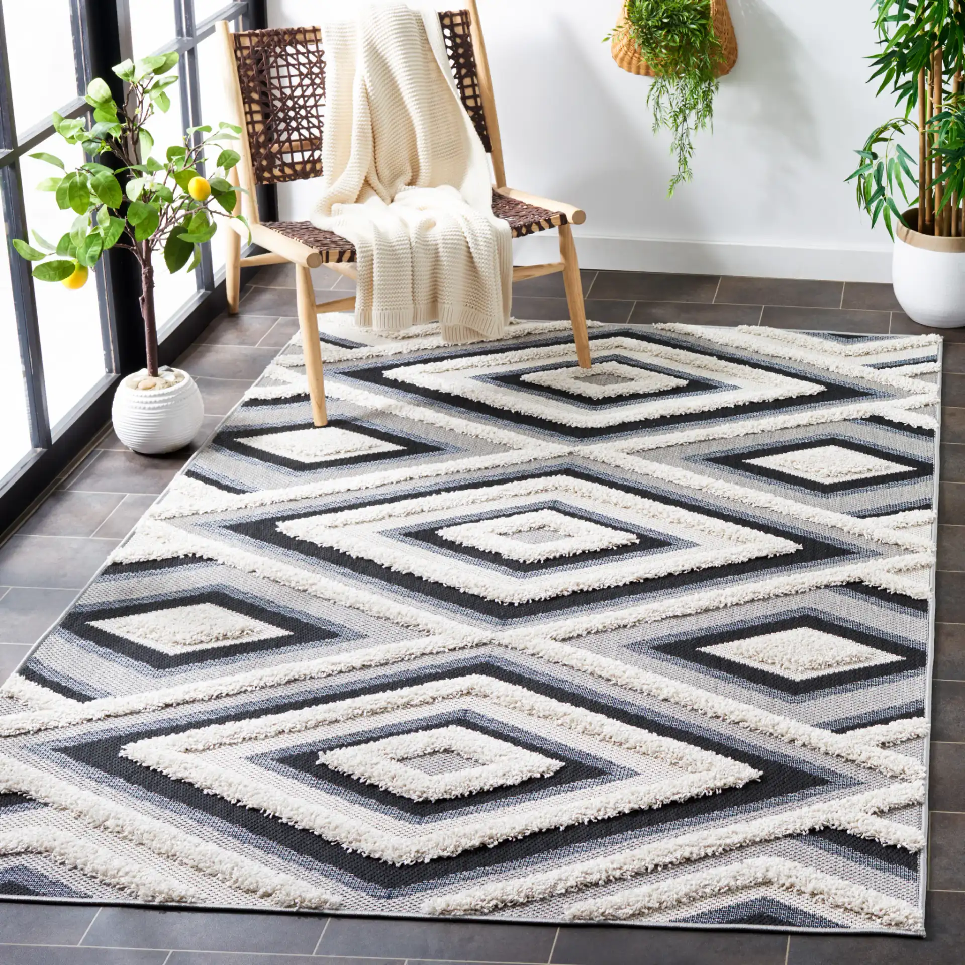 Cottage Nested Diamond Outdoor Rug in Ivory / Black in a styled room