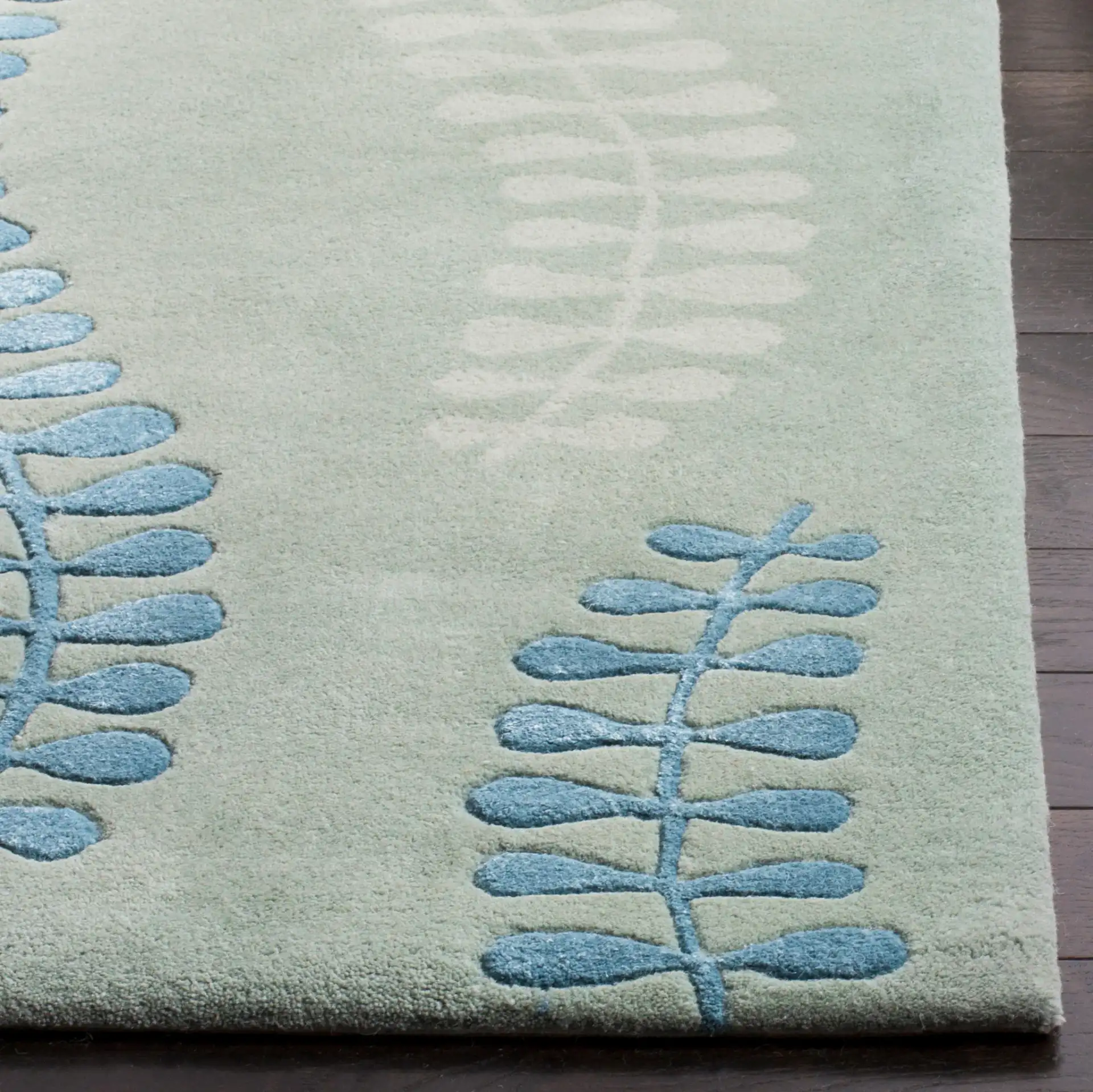 Capri Fern Hand-Tufted Wool Rug in Silver / Light Blue in a styled room