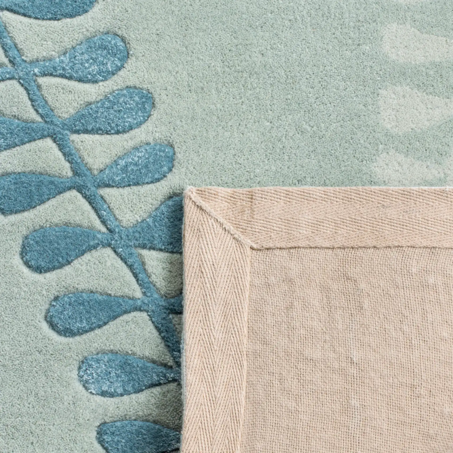 Capri Fern Hand-Tufted Wool Rug in Silver / Light Blue in a styled room
