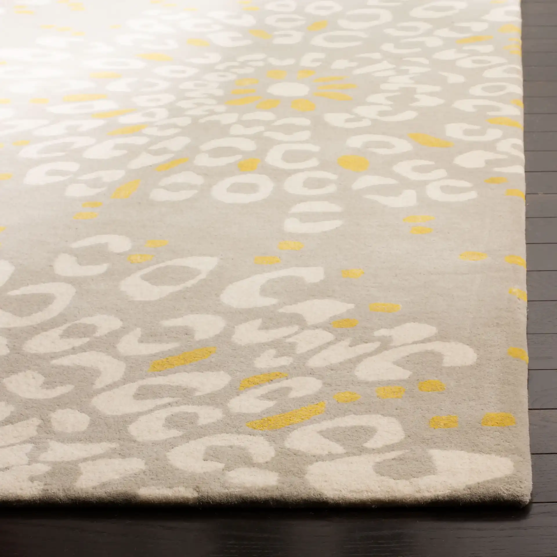 Capri Dotted Bloom Hand-Tufted Wool Rug in Gray / Ivory in a styled room
