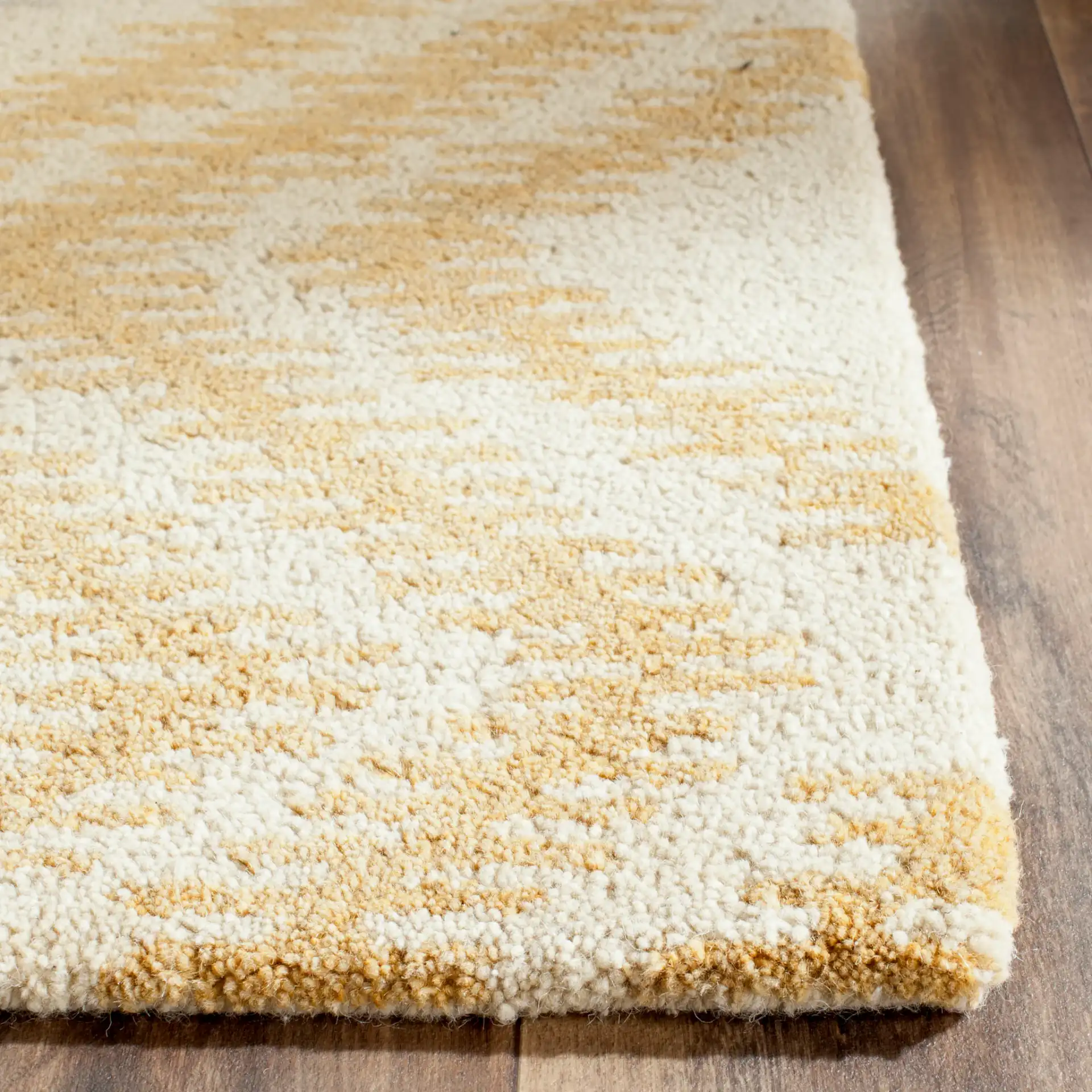Capri Zigzag Hand-Tufted Wool Rug in Gray / Gold in a styled room