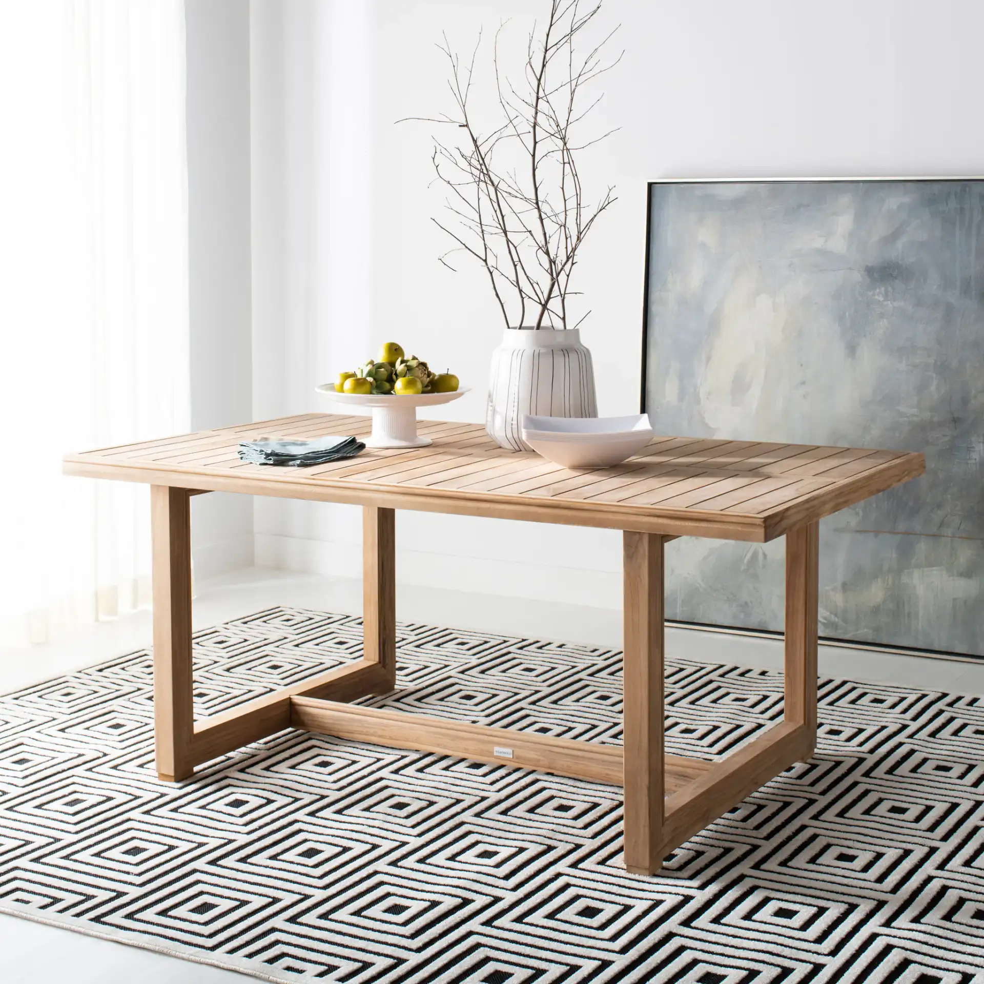 Montford Teak Dining Table in Natural Teak in a styled room