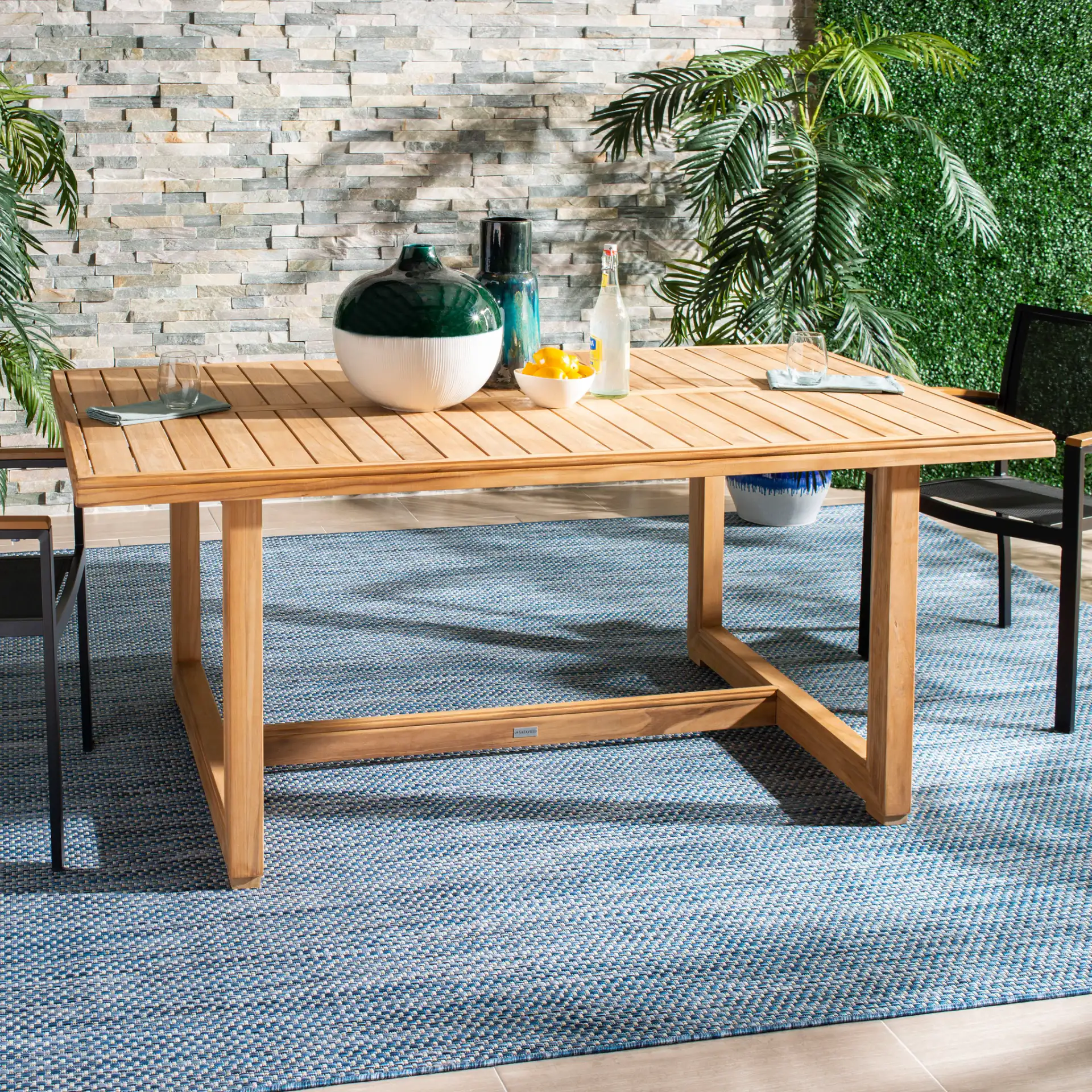 Montford Teak Dining Table in Natural Teak in a styled room