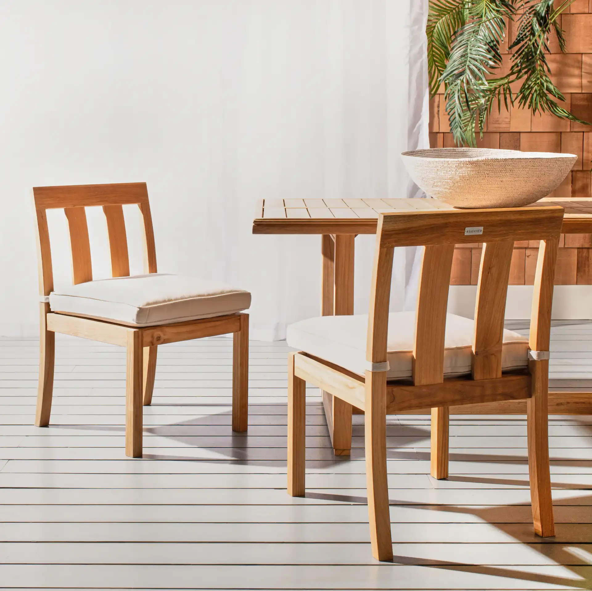 Montford Teak Dining Chair (Set of 2) in Natural in a styled room