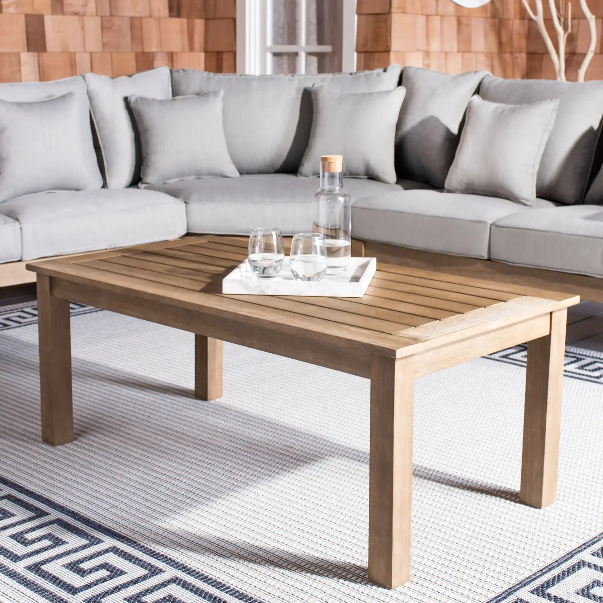 Santa Cruz Patio Coffee Table in Natural in a styled room