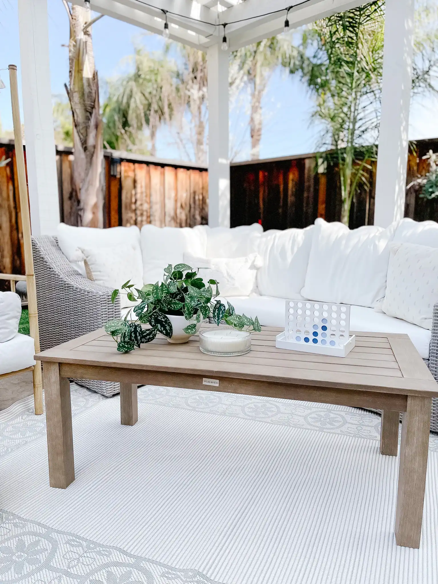 Santa Cruz Patio Coffee Table in Natural in a styled room