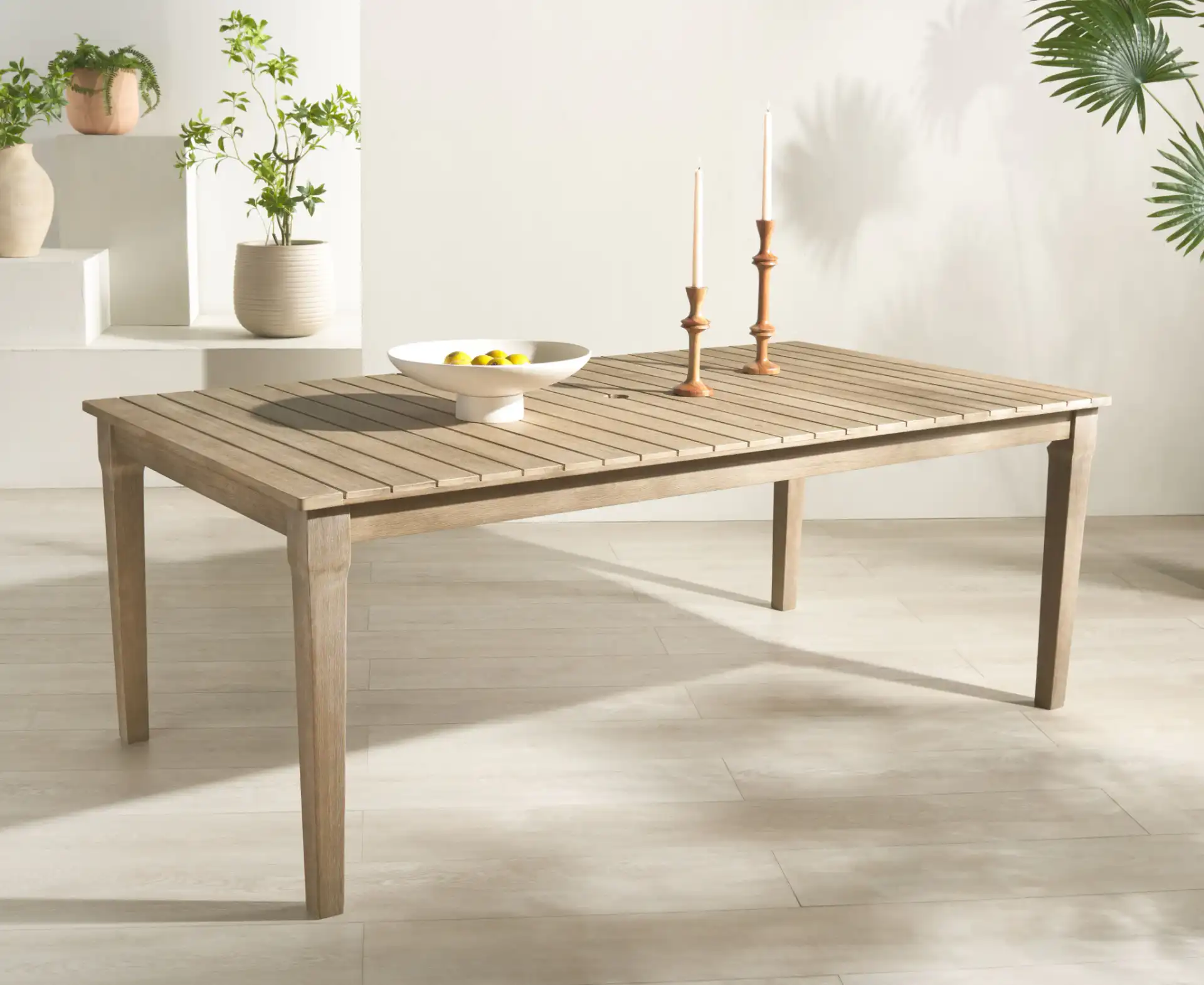Dominica Outdoor Dining Table in Natural in a styled room