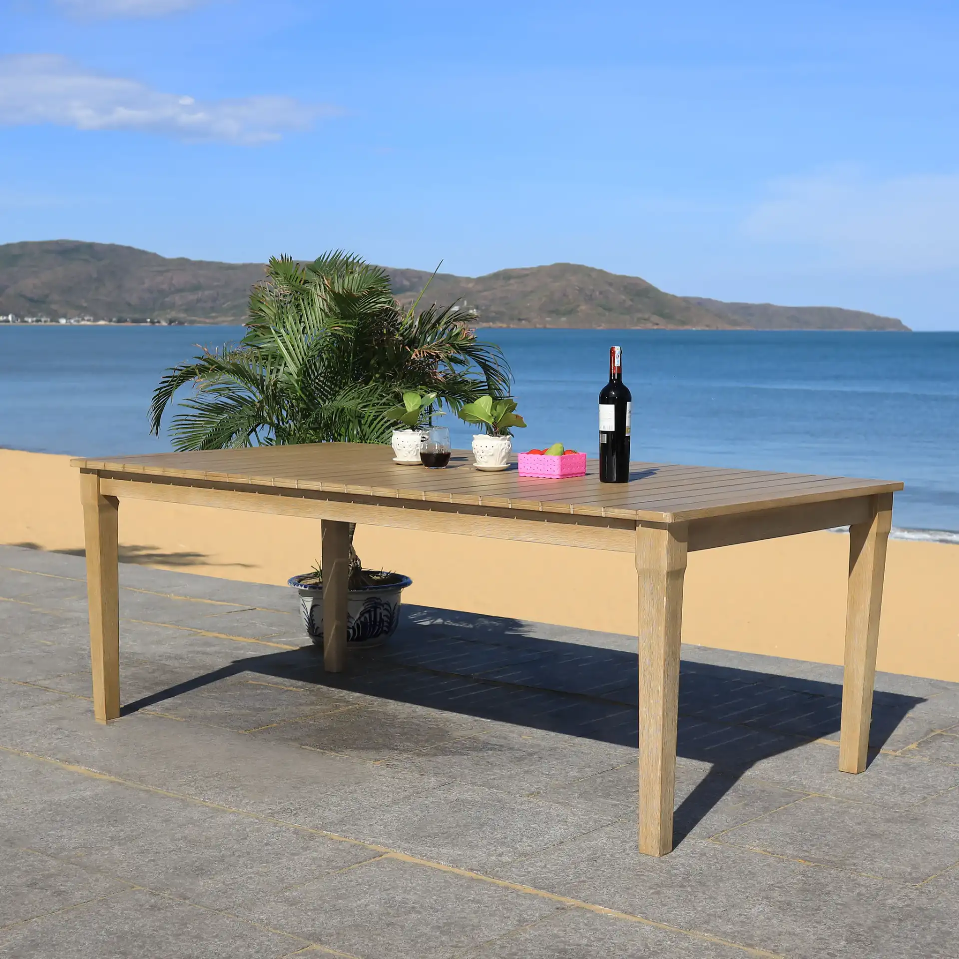Dominica Outdoor Dining Table in Natural in a styled room
