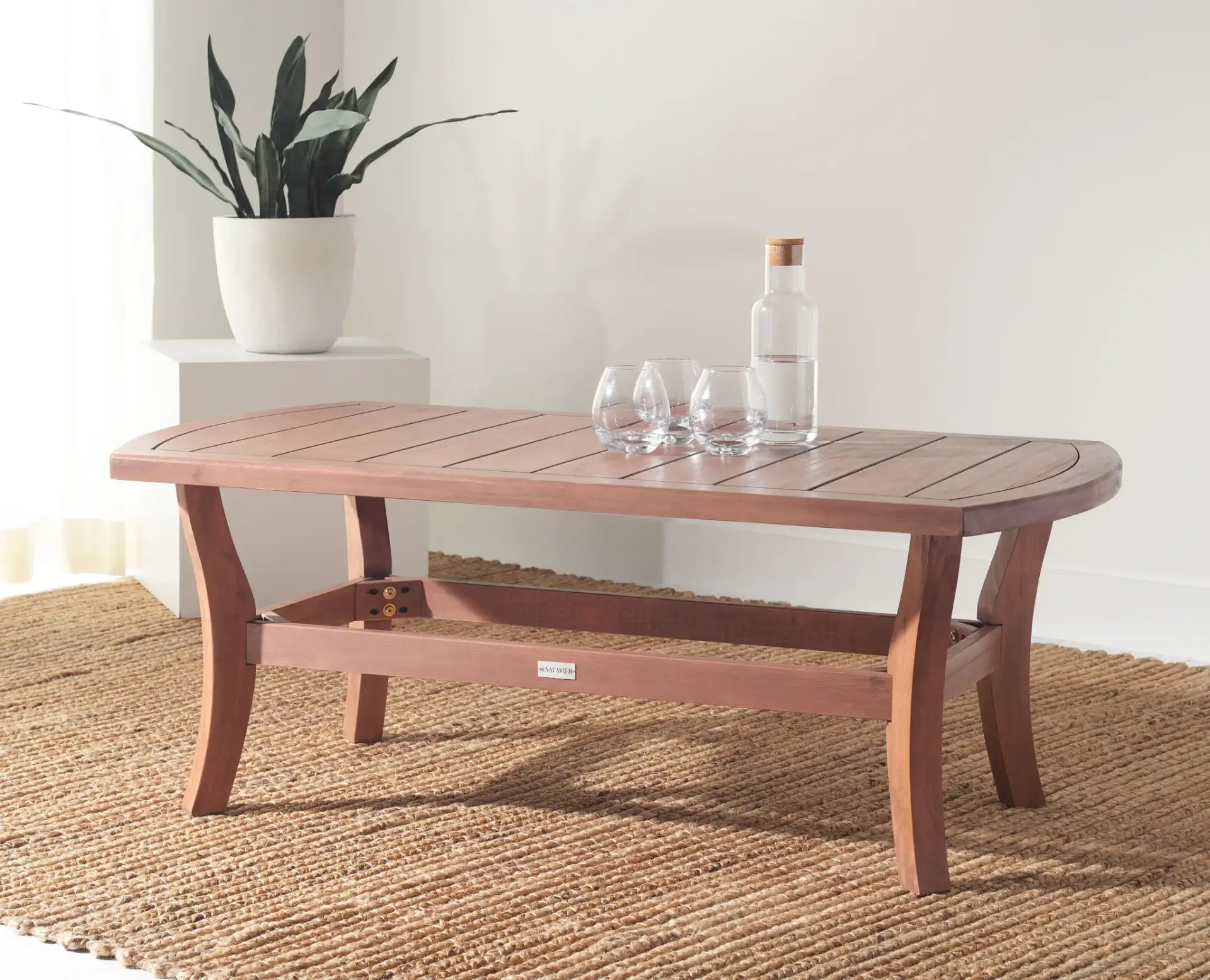 Payden Outdoor Coffee Table in Natural in a styled room