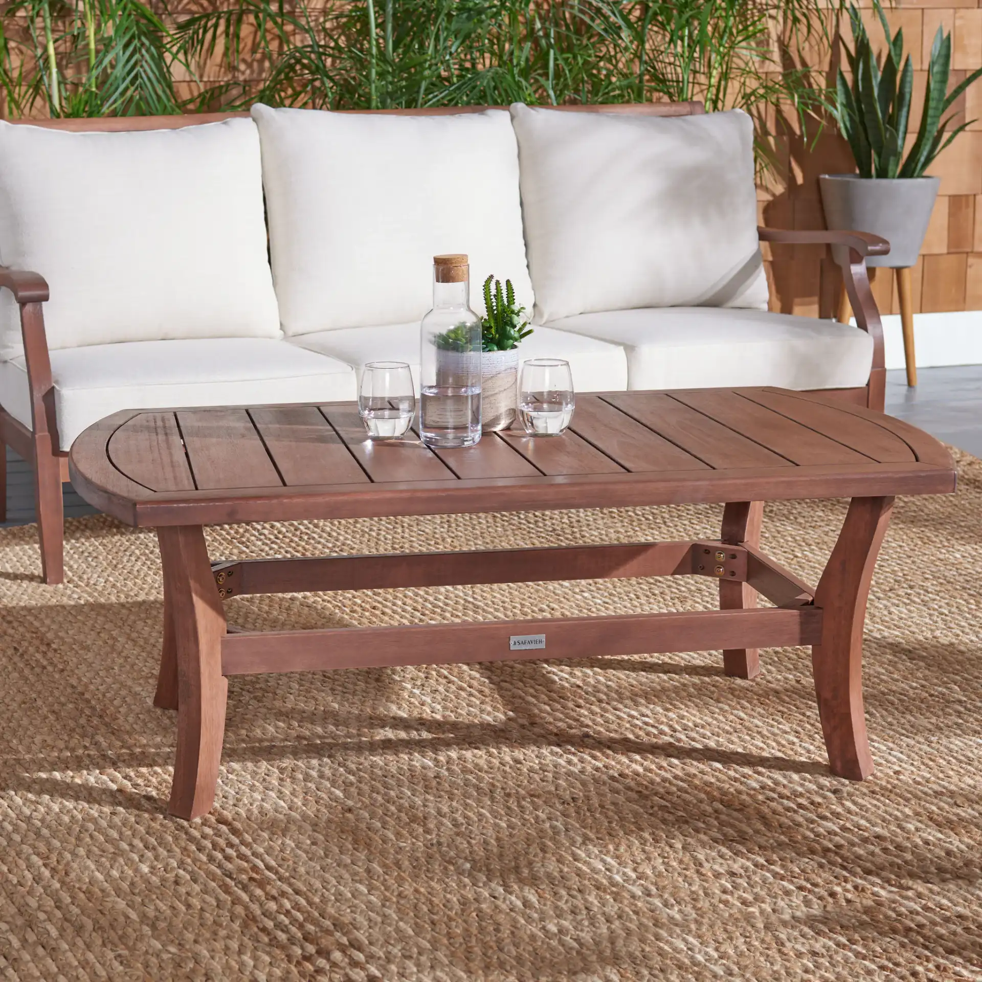 Payden Outdoor Coffee Table in Natural in a styled room