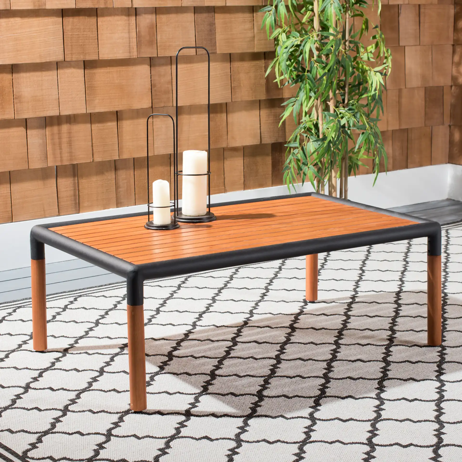 Tommy Metal & Wood Coffee Table in Black / Natural in a styled room