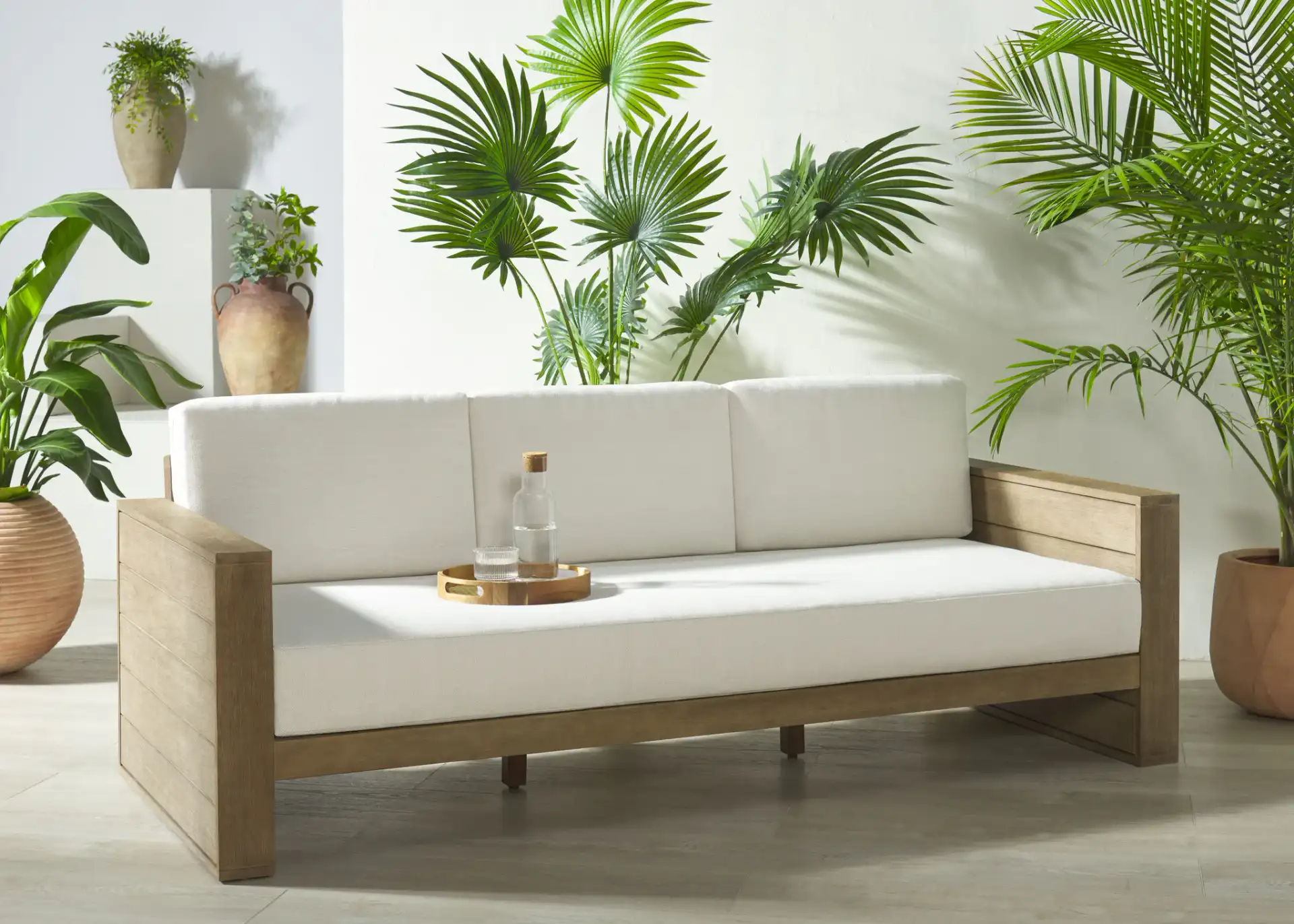 Santiago Eucalyptus Patio Sofa in Natural / Beige in a styled room