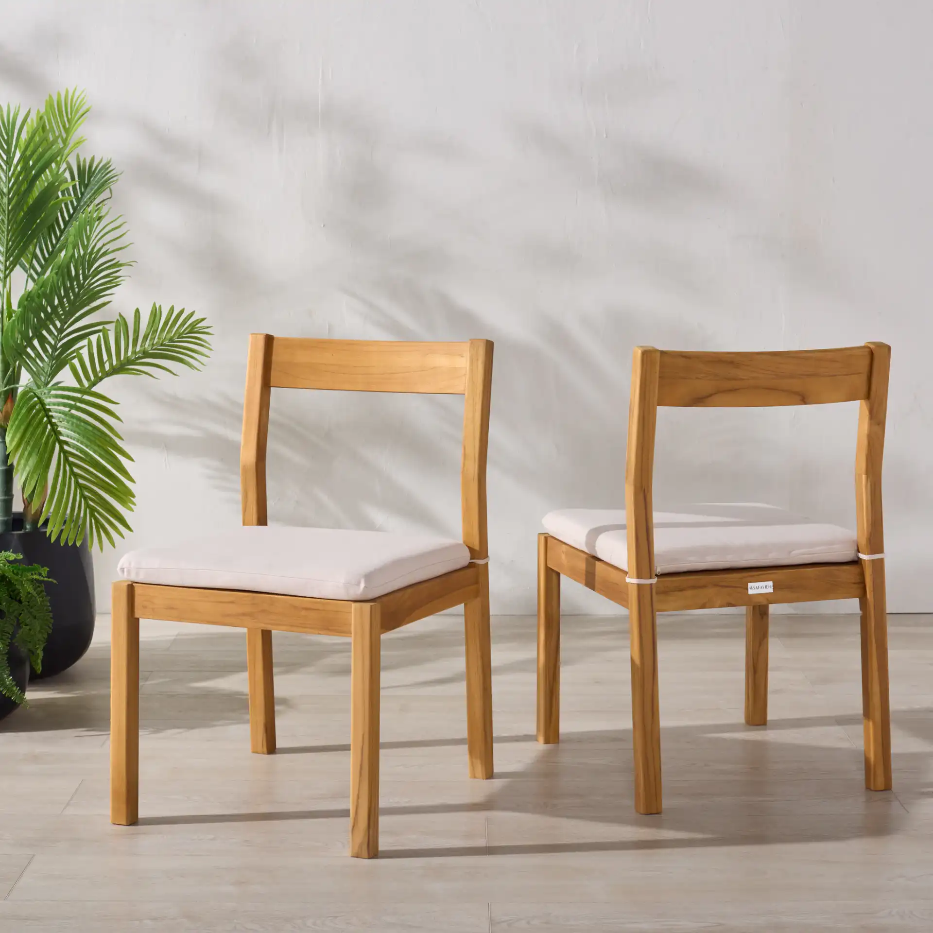 Mayaguana Teak Dining Chair (Set of 2) in Natural / White in a styled room