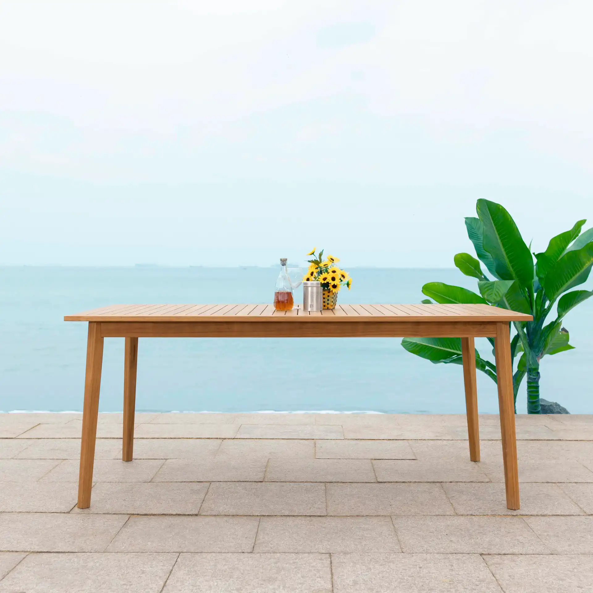 Mayaguana Teak Dining Table in Natural in a styled room