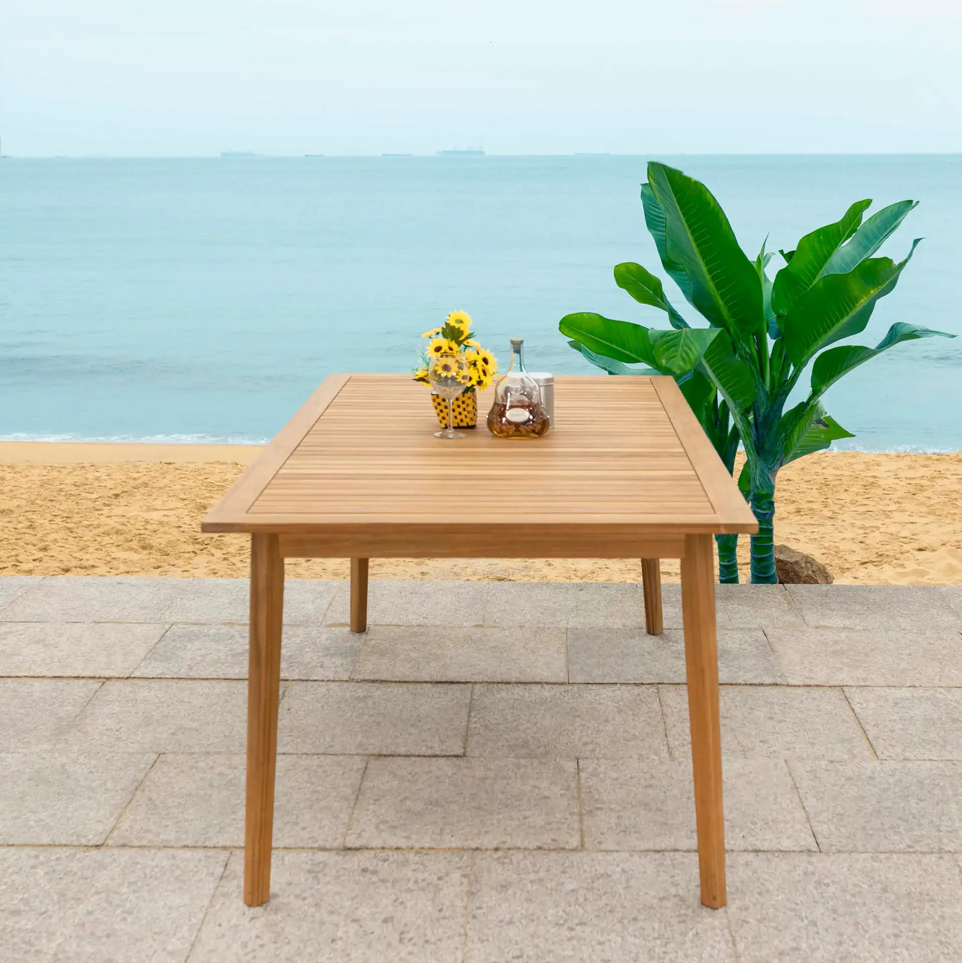 Mayaguana Teak Dining Table in Natural in a styled room