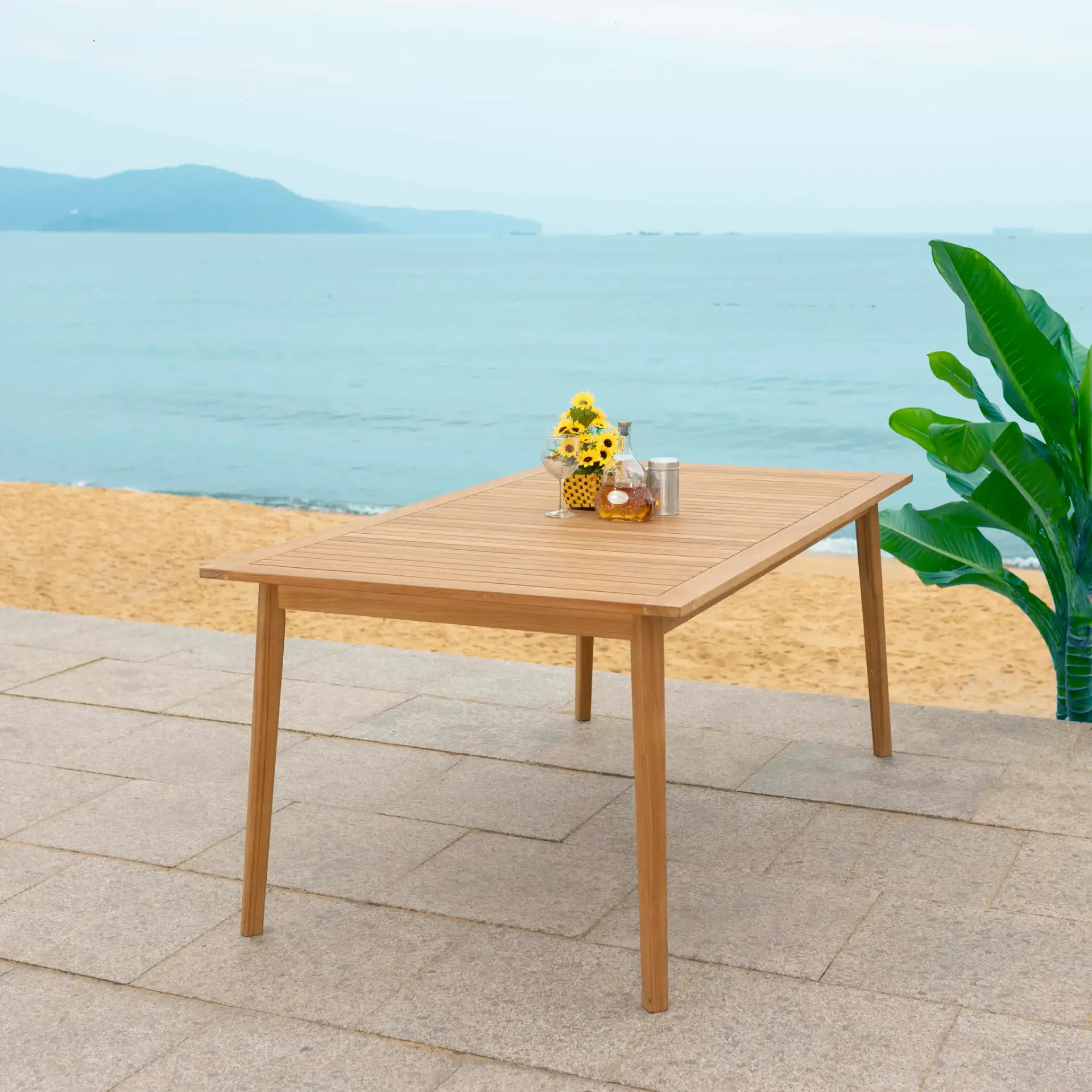 Mayaguana Teak Dining Table in Natural in a styled room