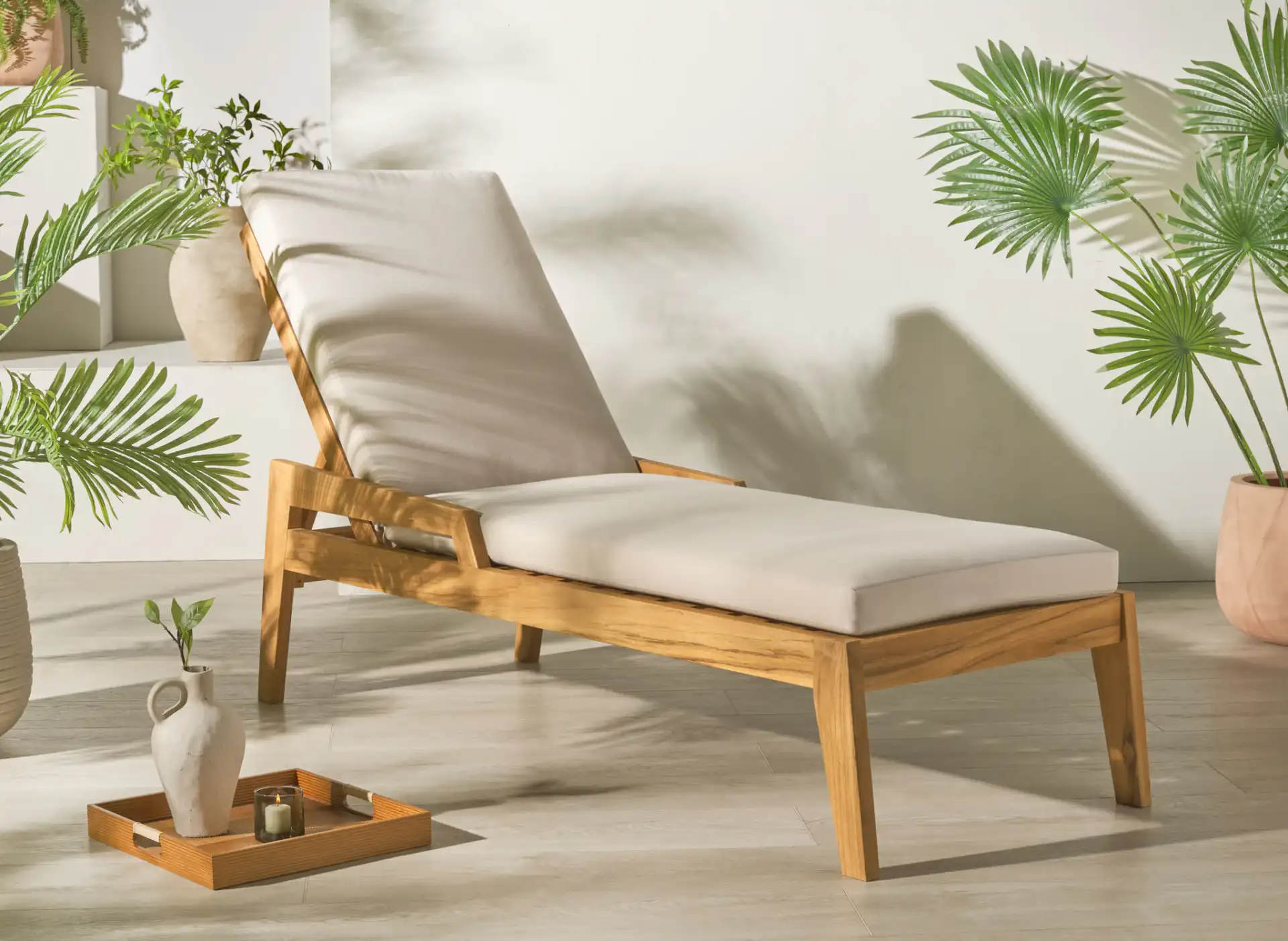 Caledonia Teak Chaise Lounge in Natural / White in a styled room