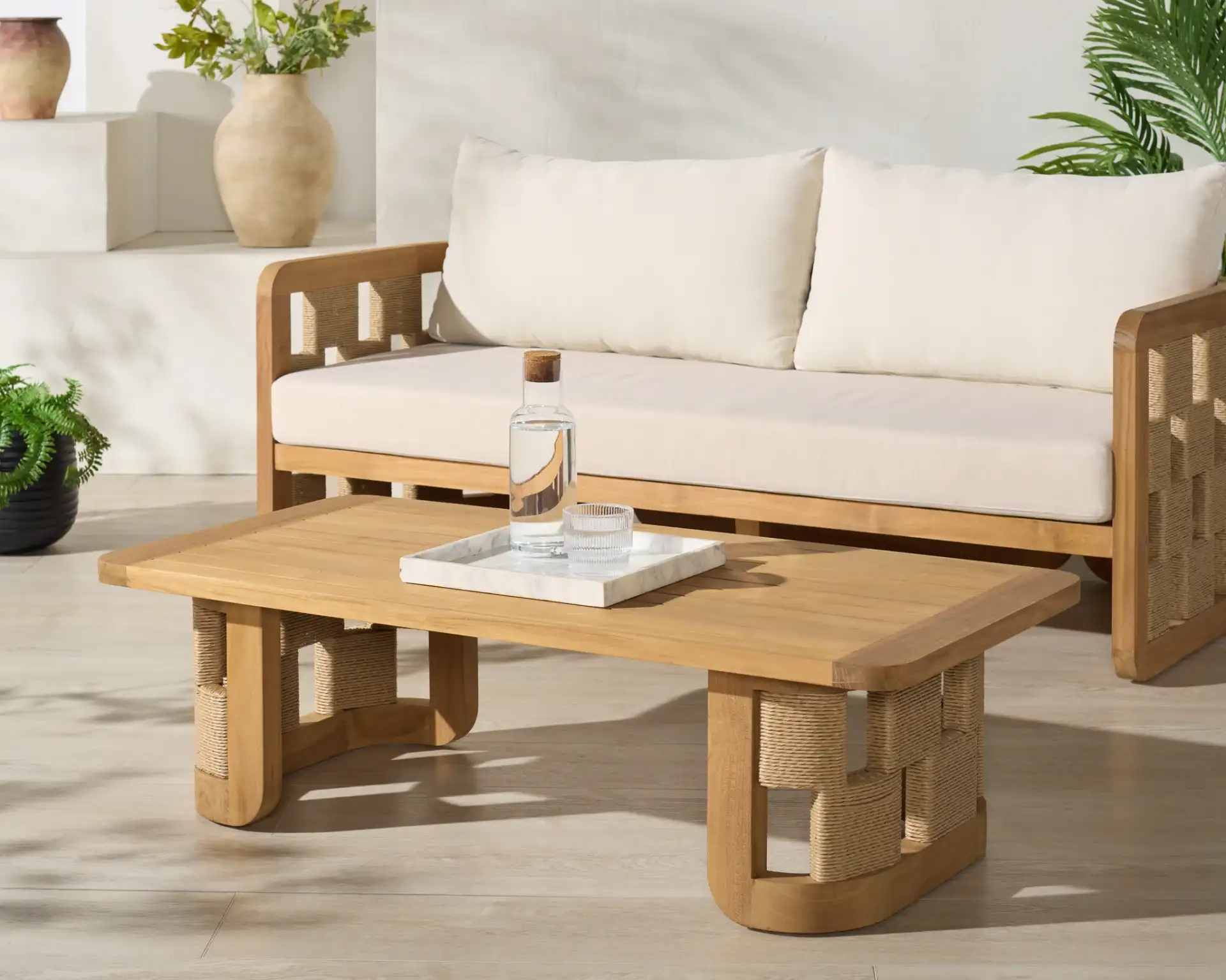 Skipper Teak Coffee Table in Natural in a styled room