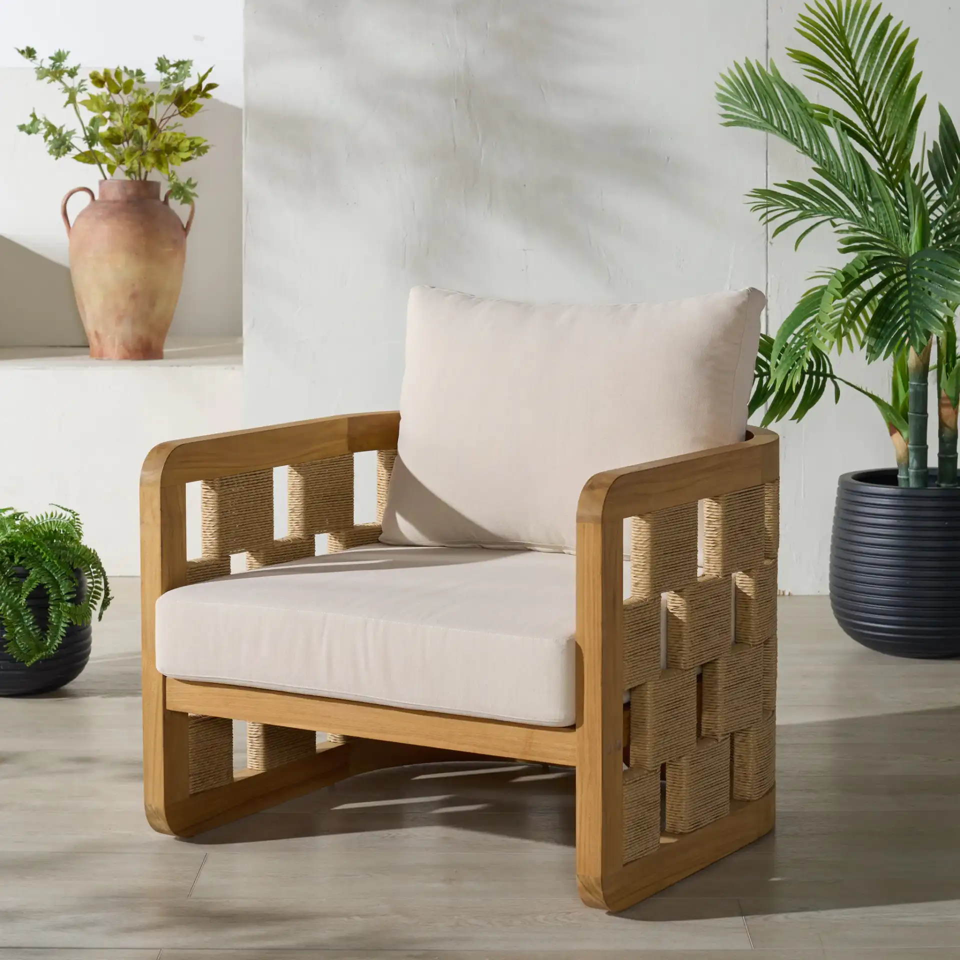 Skipper Teak Patio Chair in Natural / Beige in a styled room