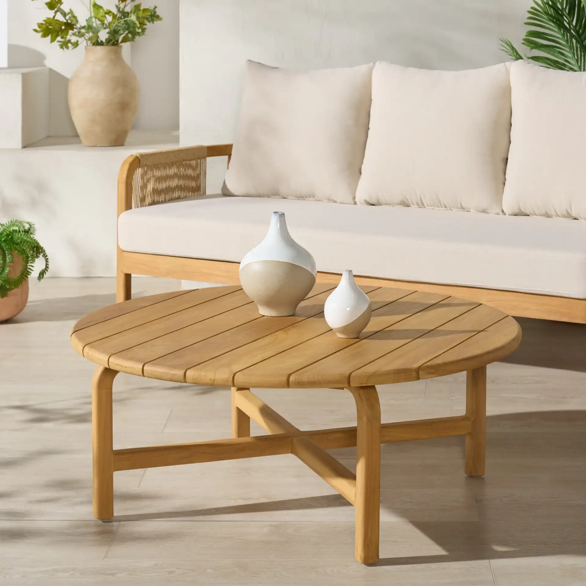 Rogers Teak Coffee Table in Natural in a styled room