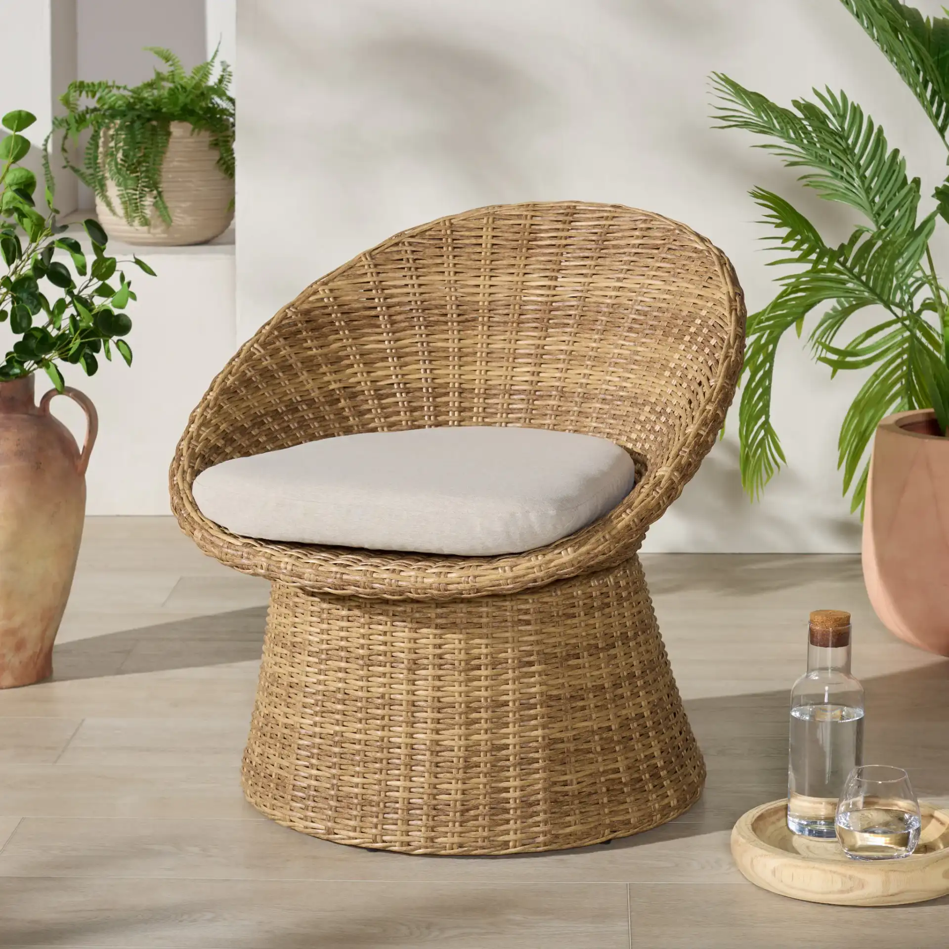 Lynsee Wicker Patio Chair in Natural in a styled room