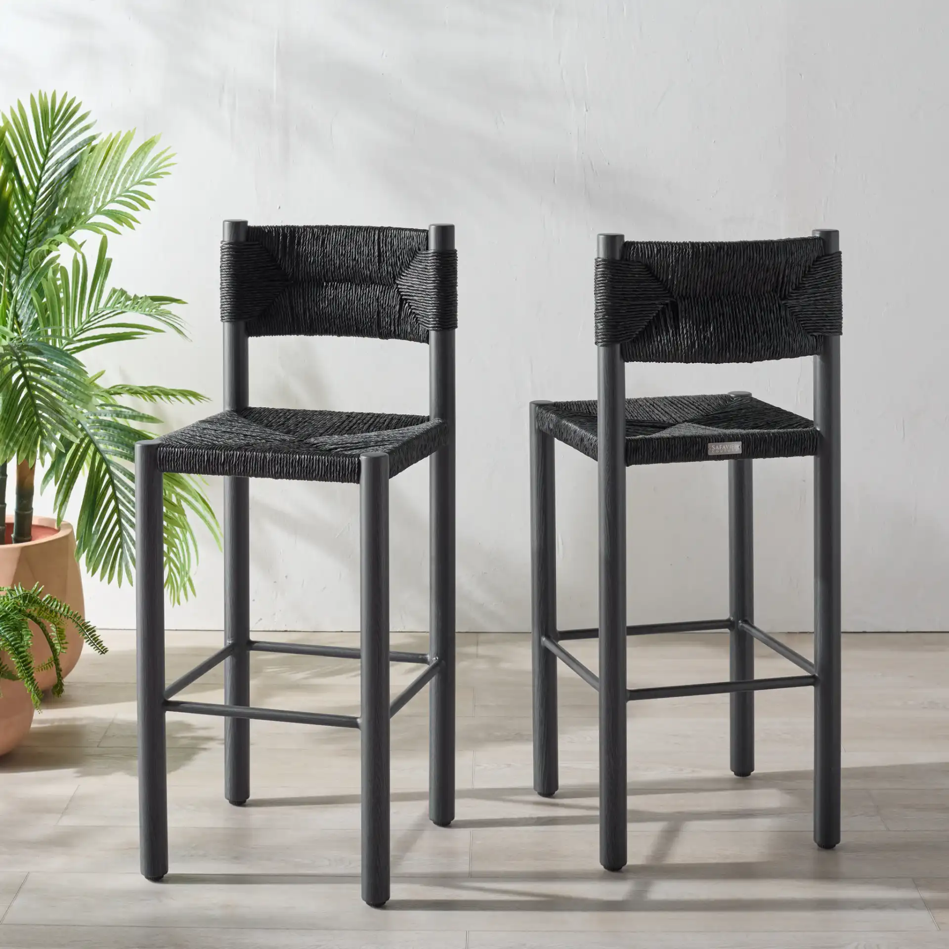 Romona Outdoor Barstool (Set of 2) in Black in a styled room