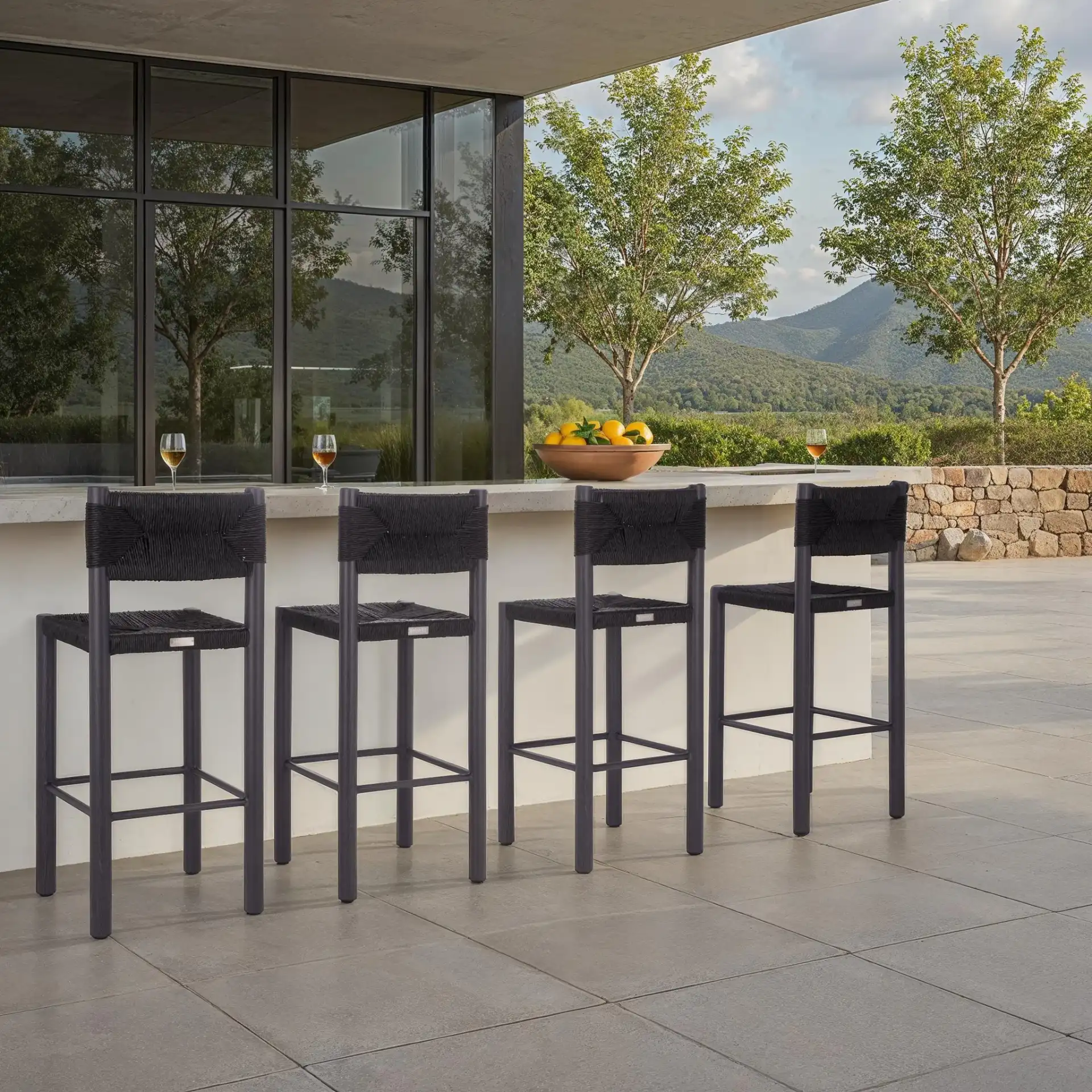 Romona Outdoor Barstool (Set of 2) in Black in a styled room