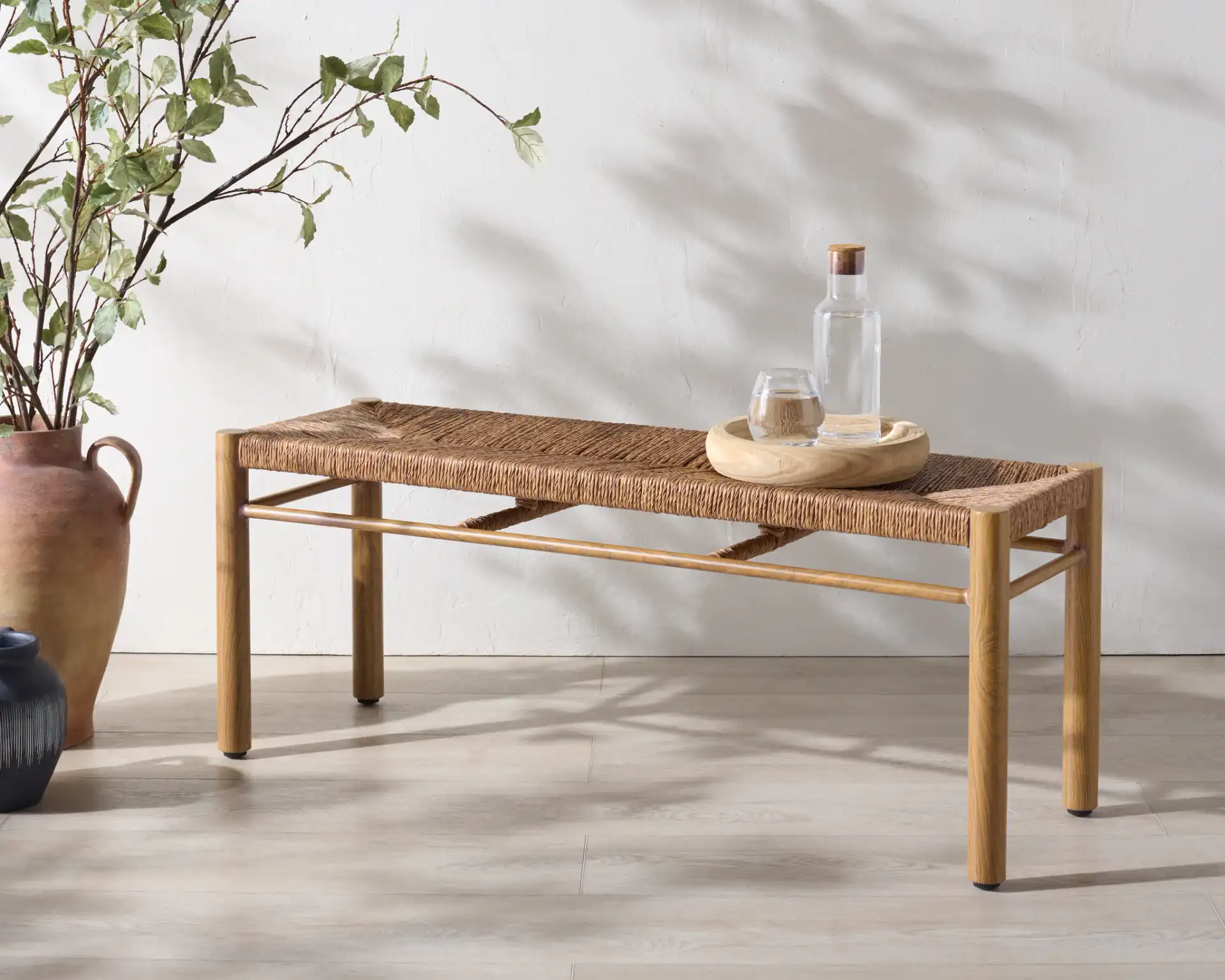 Romona Outdoor Bench in Natural in a styled room