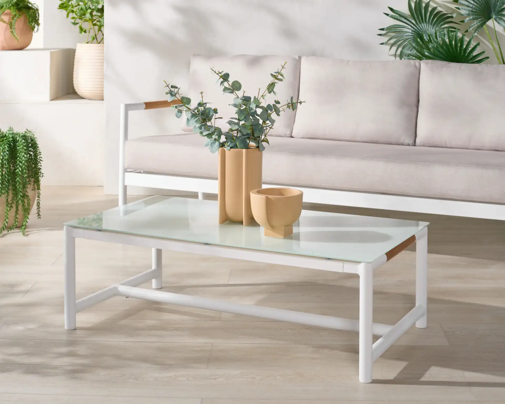 Chryssa Aluminum Coffee Table in White in a styled room