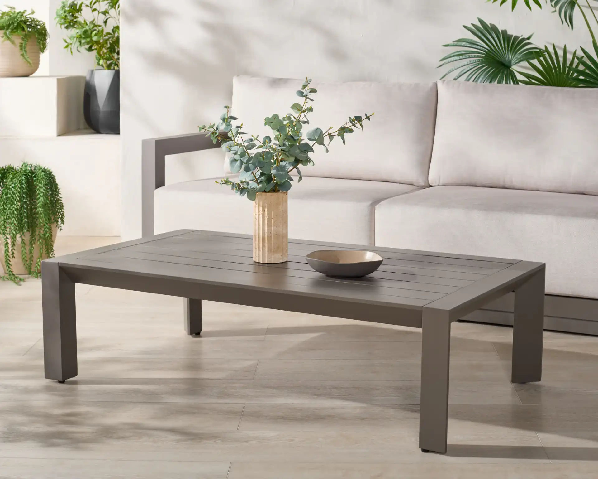 Donaldo Aluminum Coffee Table in Dark Gray in a styled room