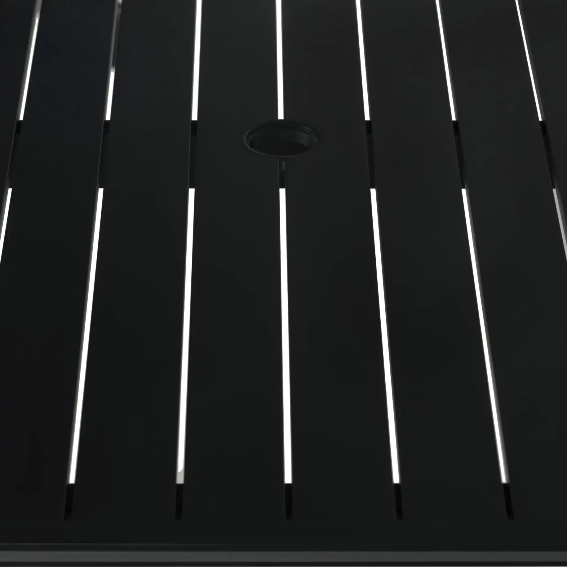 Capricio Aluminum 90" Outdoor Dining Table in Black in a styled room