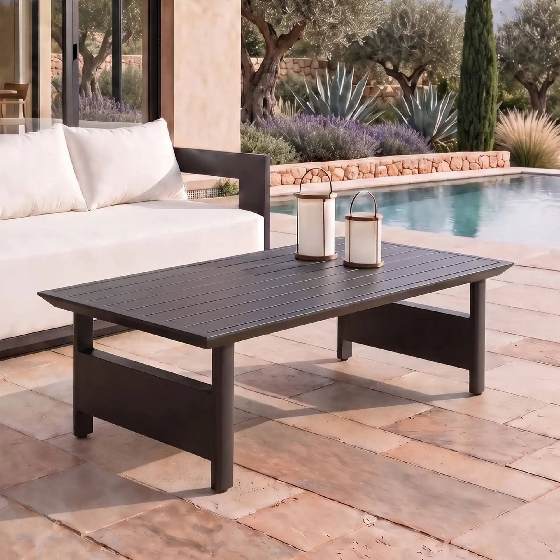 Capricio Aluminum Outdoor Coffee Table in Black in a styled room
