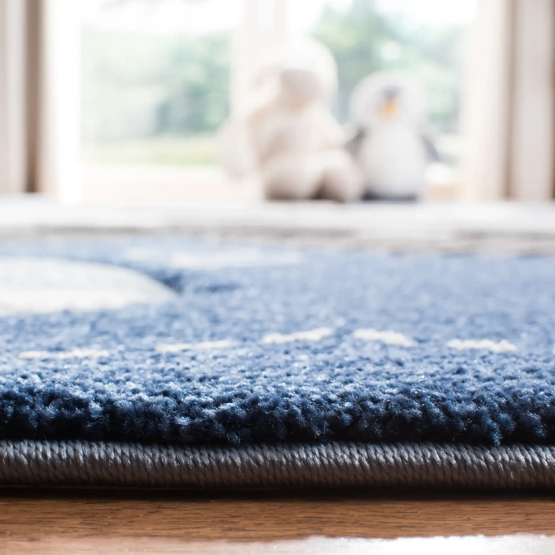Carousel Kids Noah'S Ark Rug in Blue / Gray in a styled room