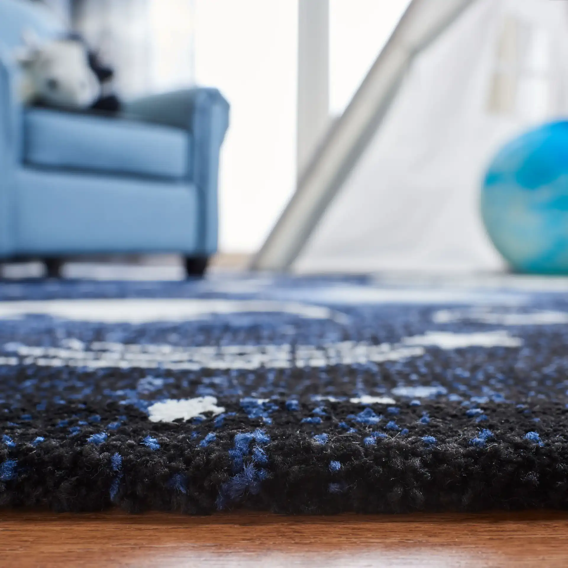 Carousel Kids Outer Space Rug in Dark Blue / Light Blue in a styled room