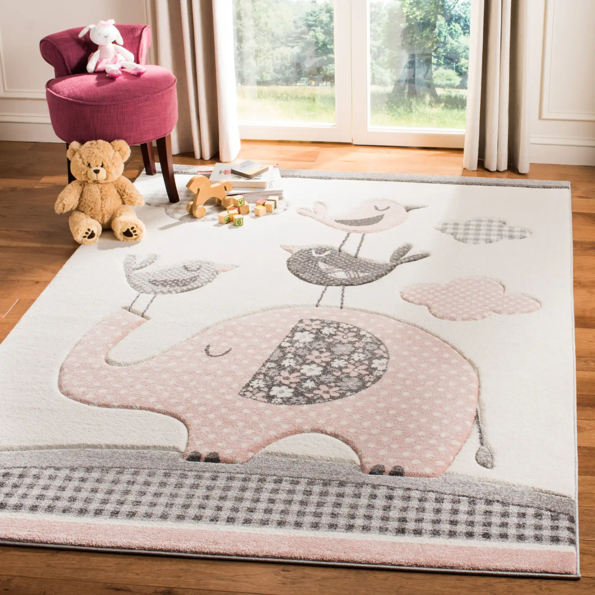 Carousel Kids Elephant And Birds Rug in Pink / Ivory in a styled room