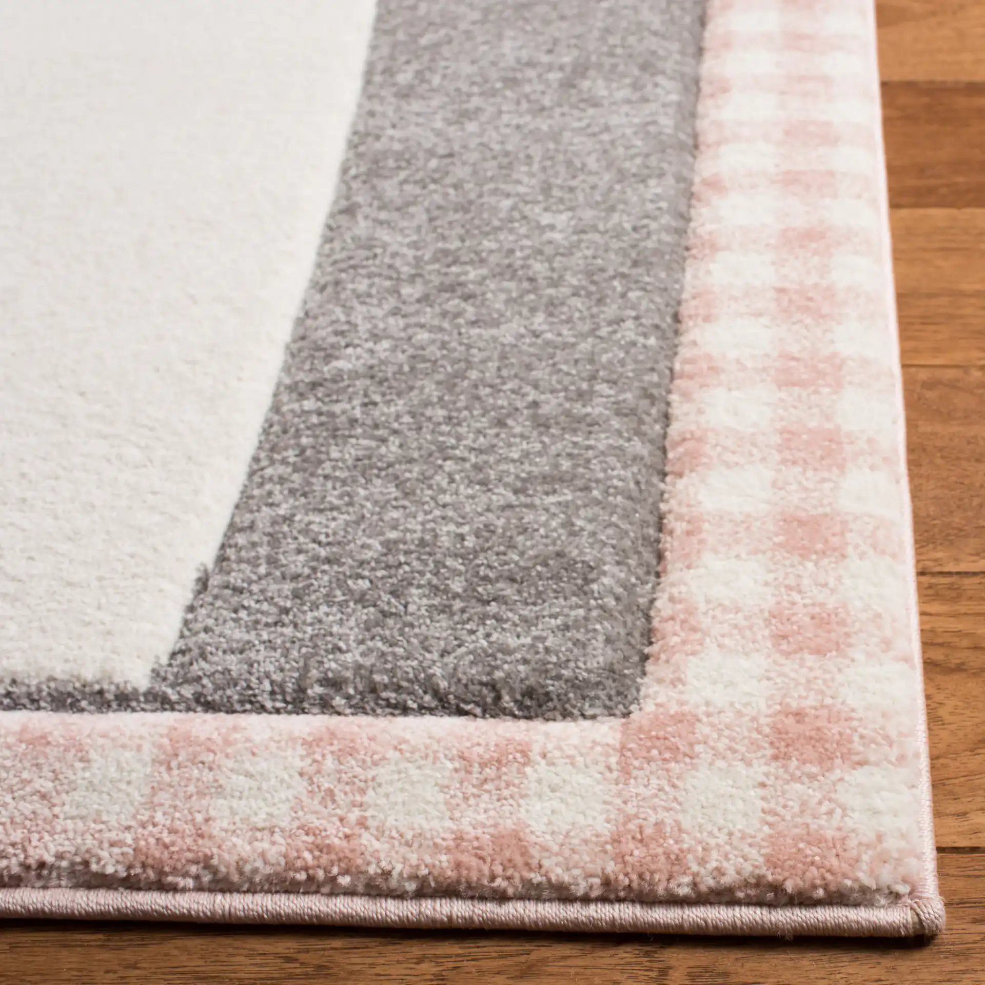 Carousel Kids Cat And Stars Rug in Pink / Gray in a styled room