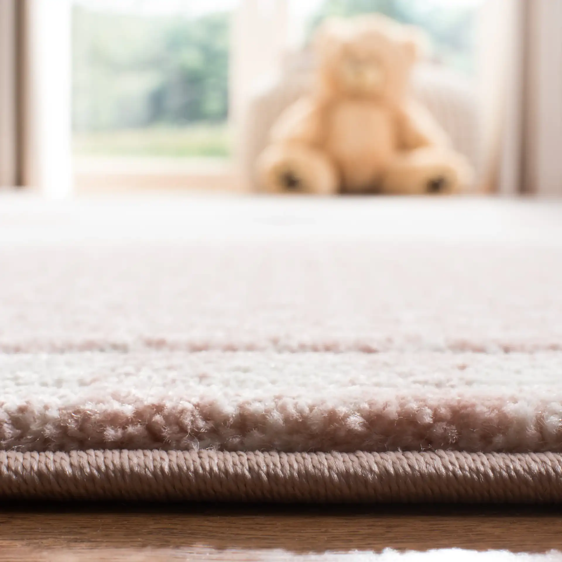 Carousel Kids Cat And Stars Rug in Pink / Gray in a styled room