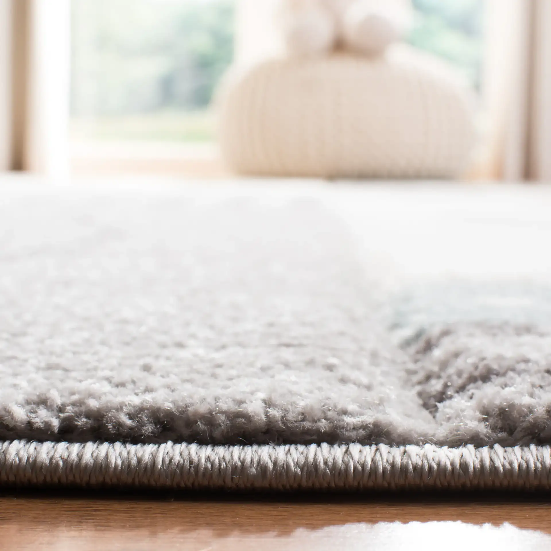 Carousel Kids Paneled Animal Rug in Gray / Ivory in a styled room