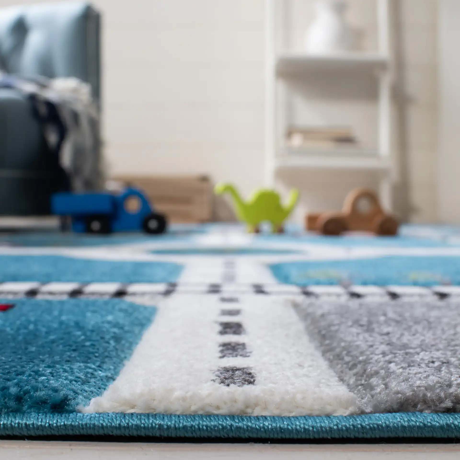 Carousel Kids Road And Railway Play Rug in Turquoise / Ivory in a styled room
