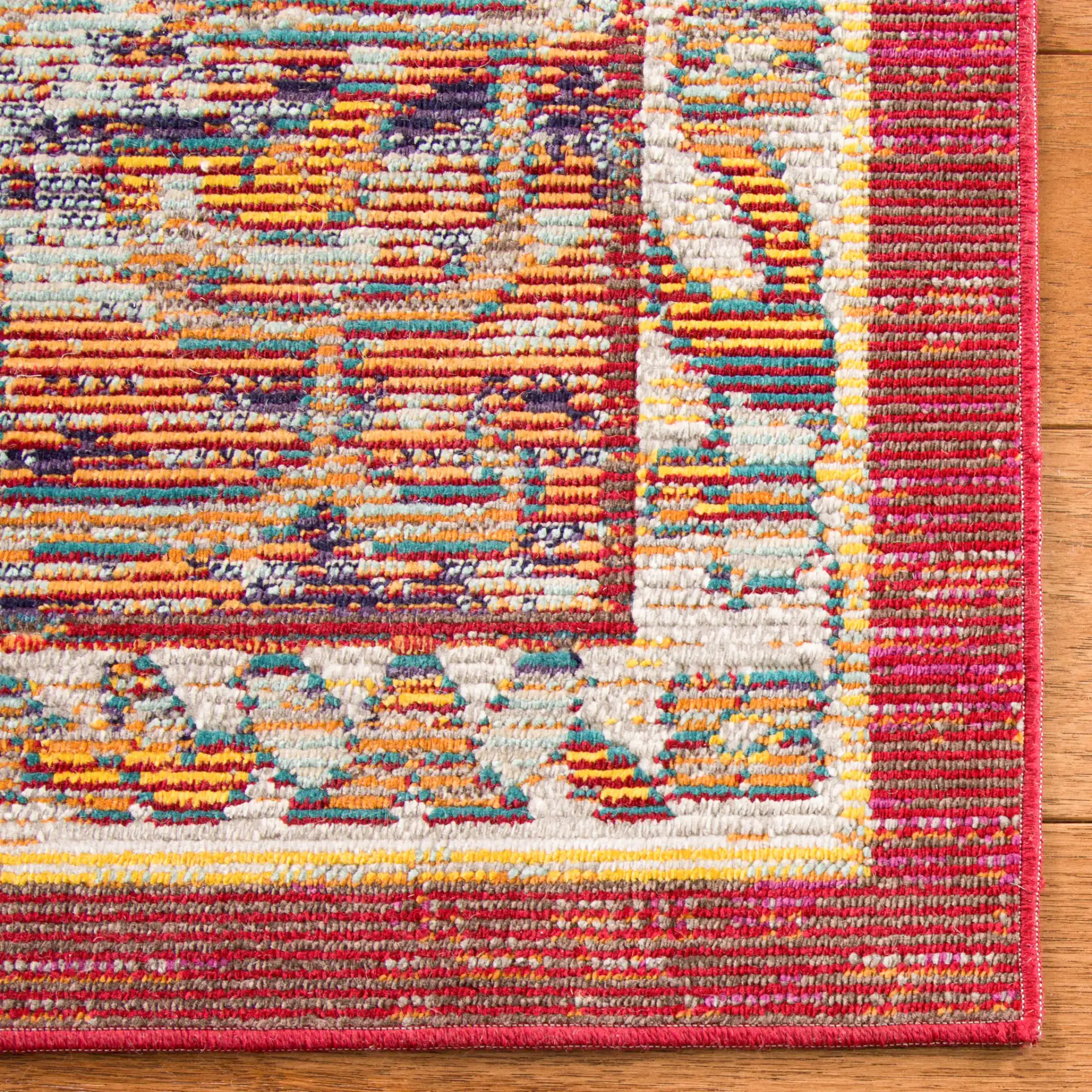 Crystal Medallion Bordered Rug in Orange / Light Blue in a styled room