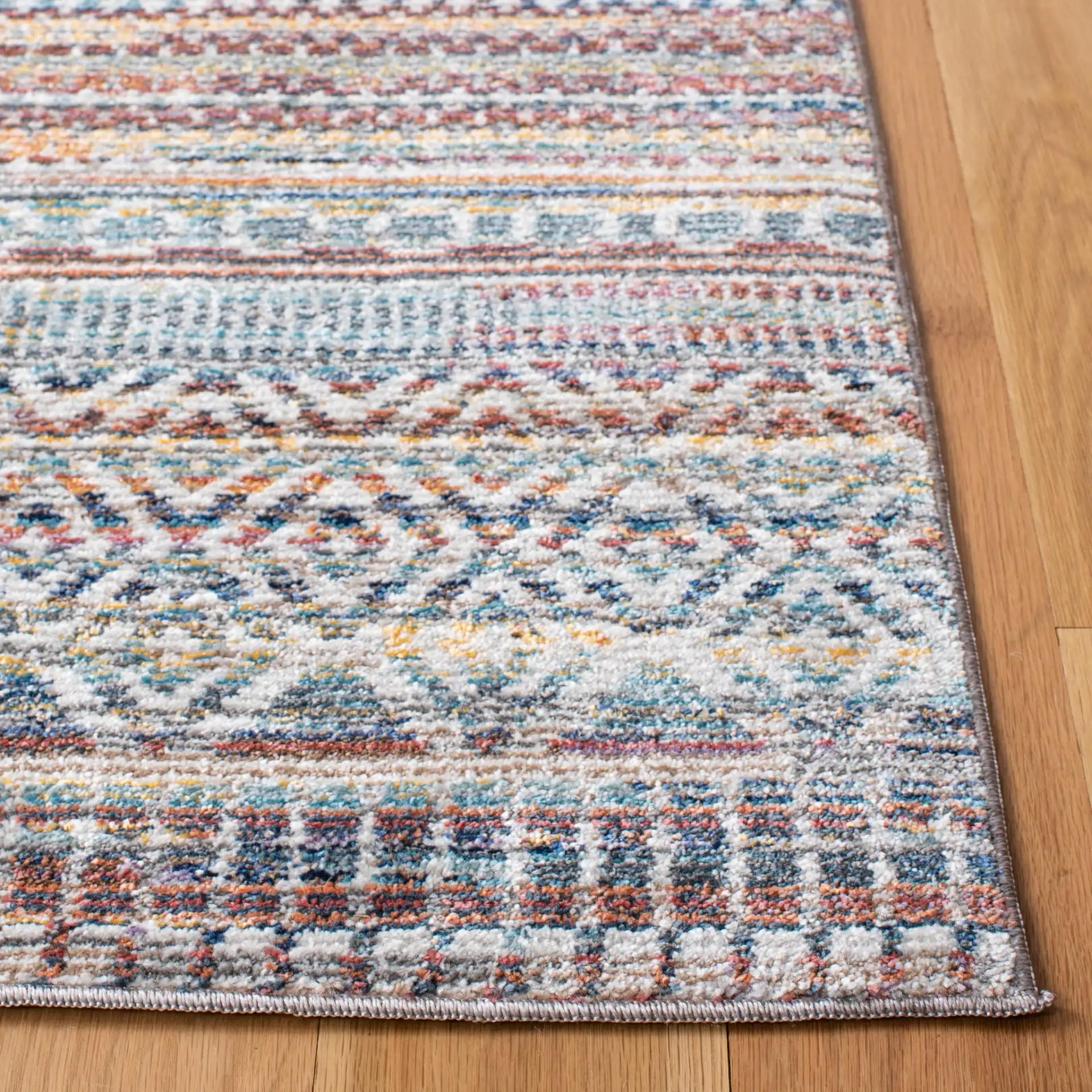 Crystal Banded Geometric Rug in Rust / Gold in a styled room