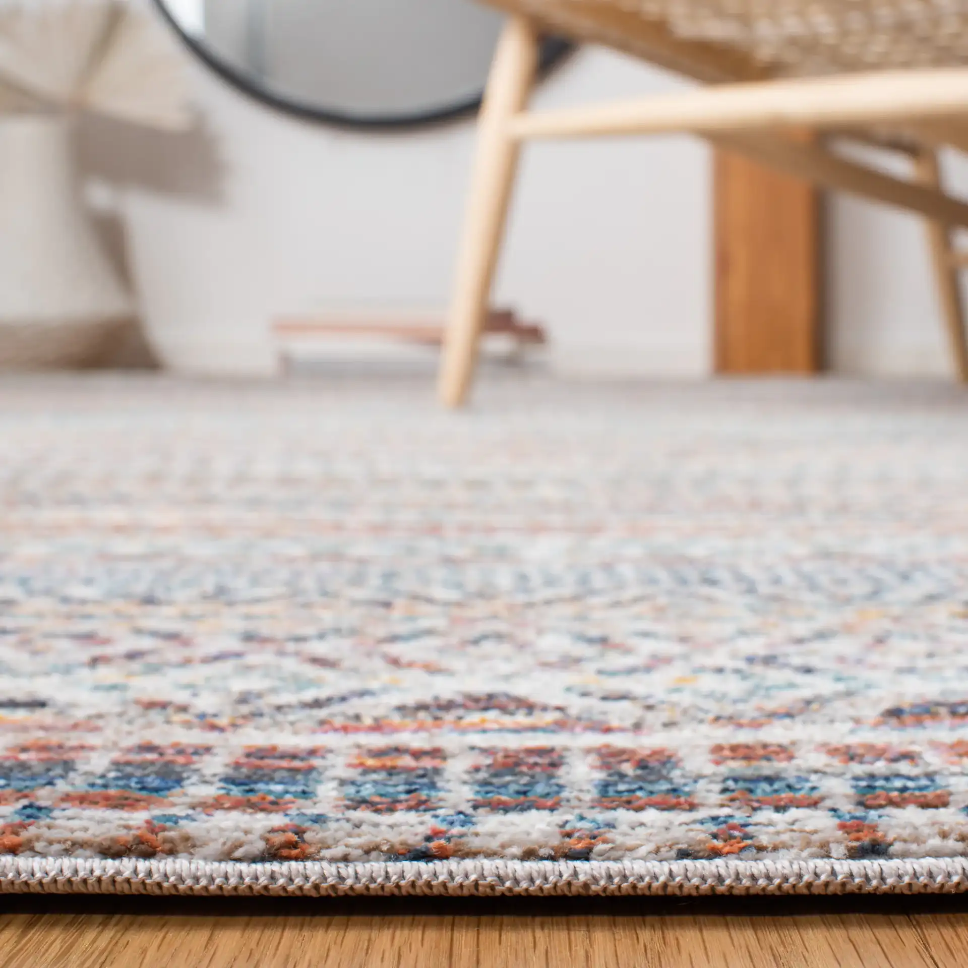 Crystal Banded Geometric Rug in Rust / Gold in a styled room