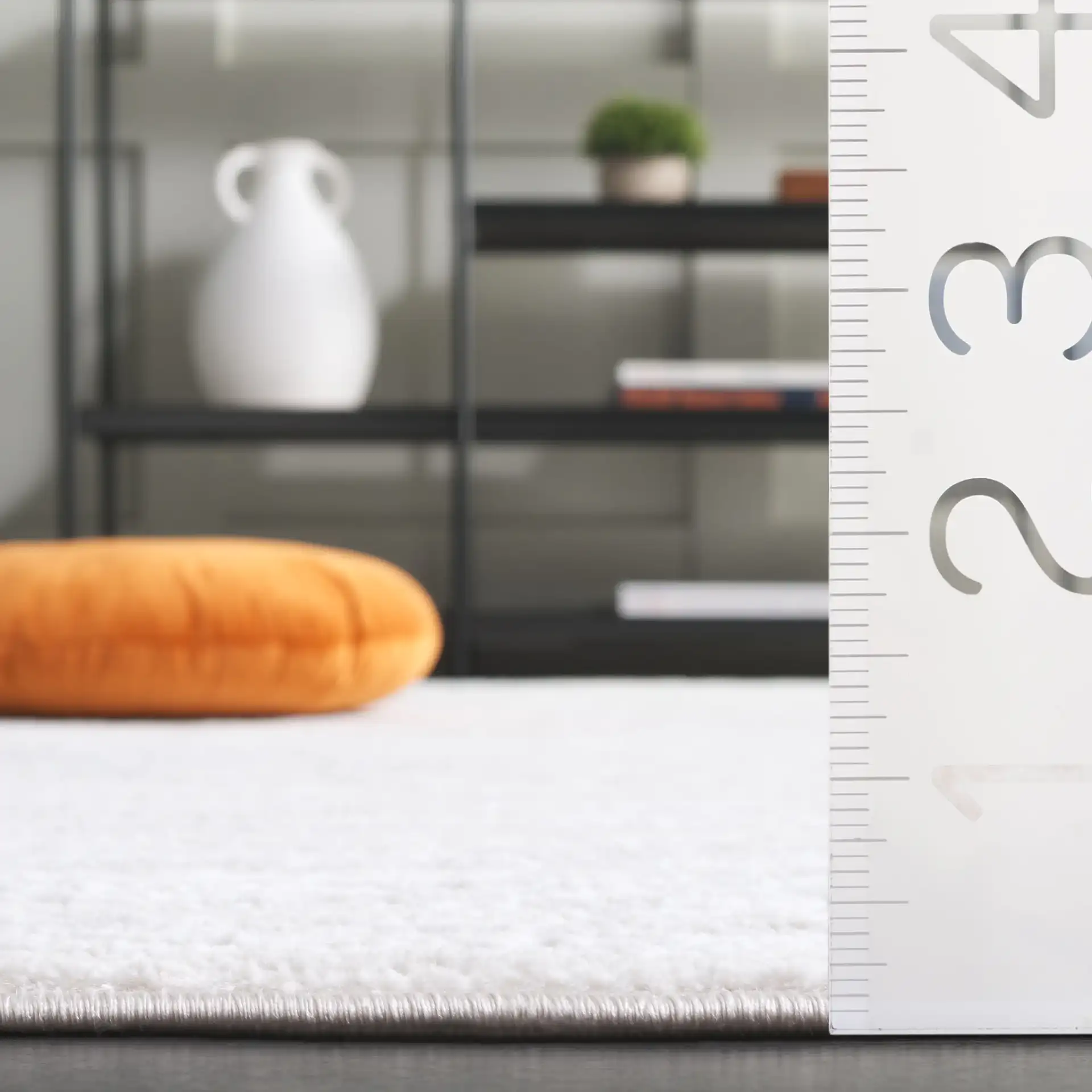 Carter Linear Striation Rug in Ivory / Taupe in a styled room