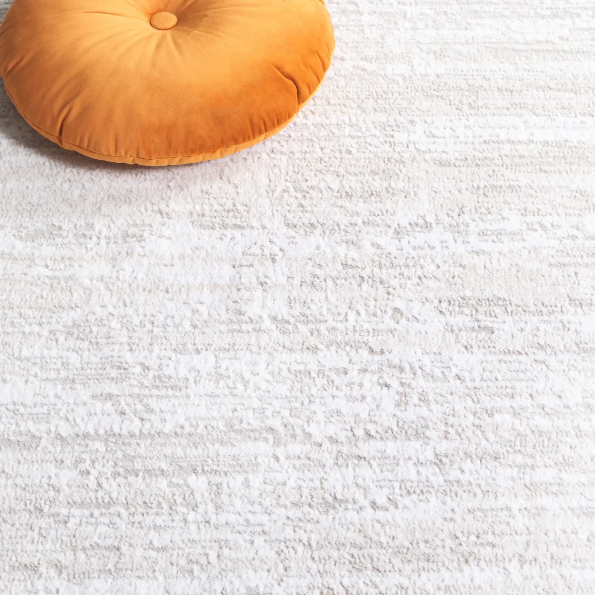 Carter Linear Striation Rug in Ivory / Taupe in a styled room