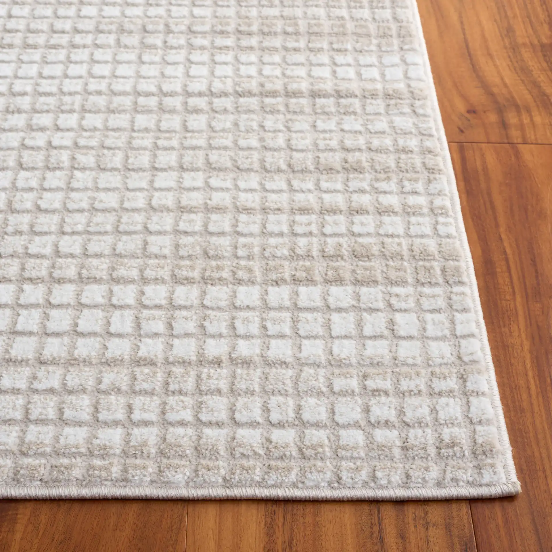 Carter Grid Rug in Ivory / Taupe in a styled room