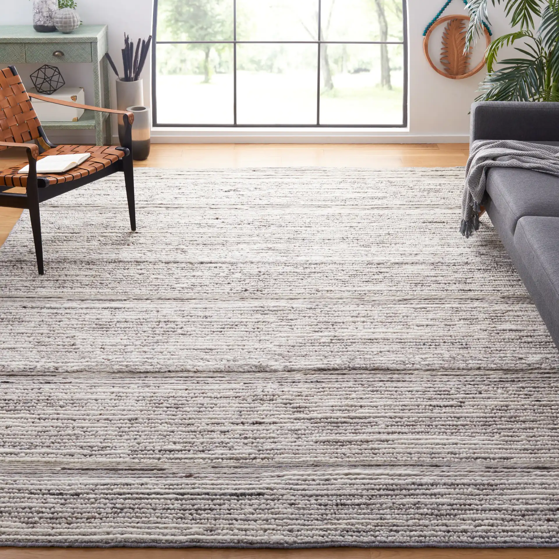 Casablanca Striped Hand-Woven Wool Rug in Gray / Ivory in a styled room