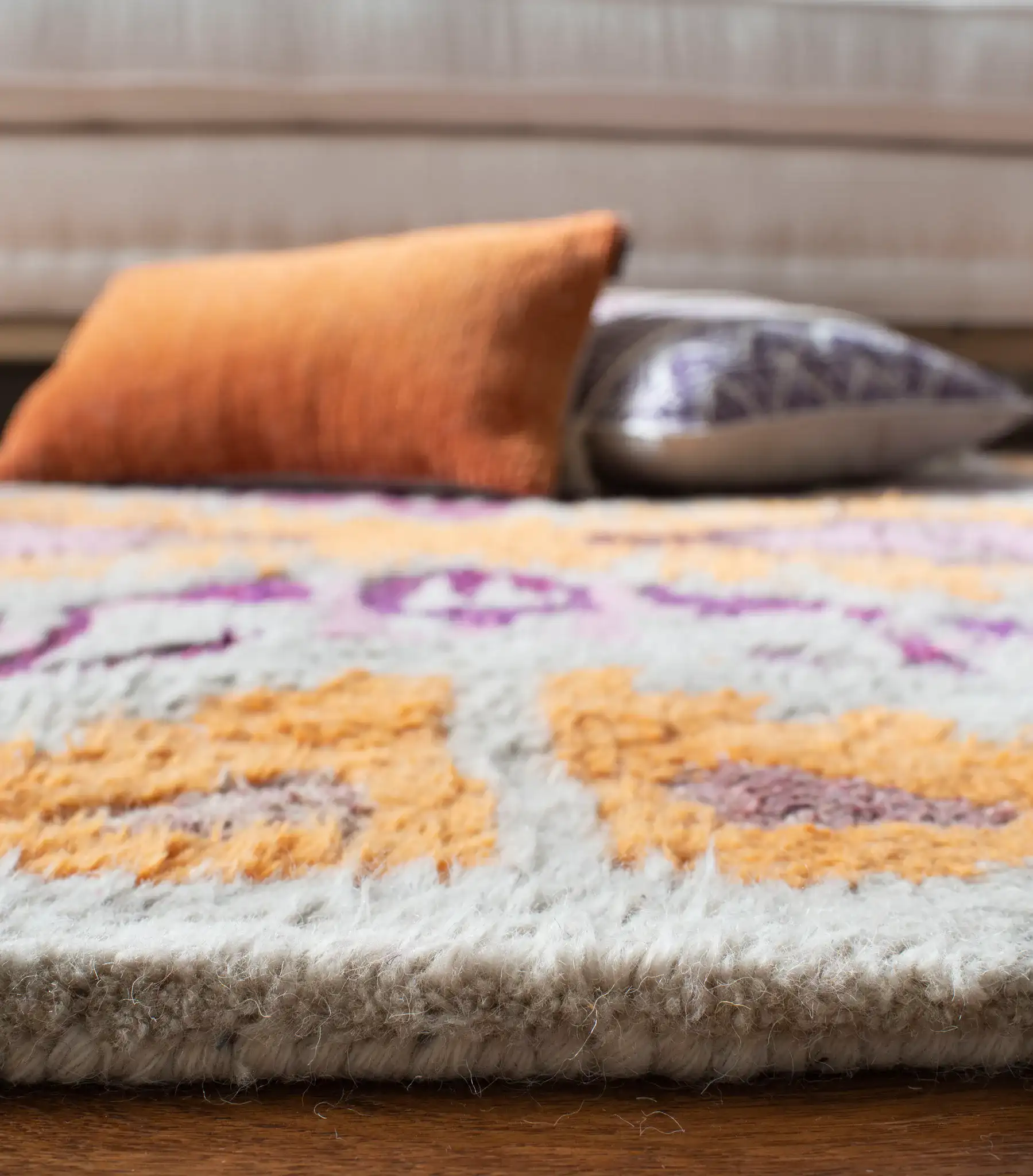 Casablanca Diamond Medallion Hand-Tufted Wool Blend Shag Rug in Ivory / Multicolor in a styled room