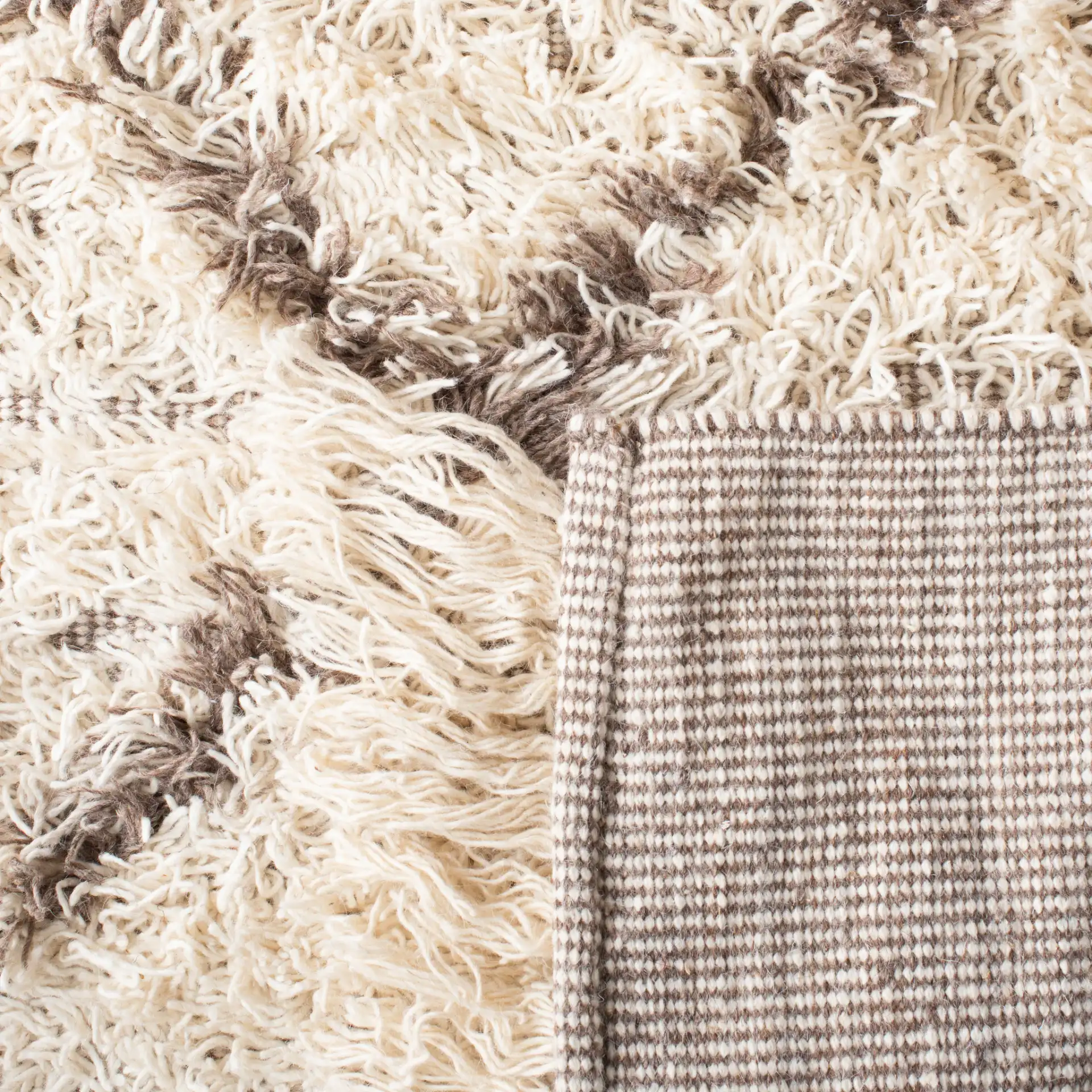 Casablanca Diamond Trellis Hand-Woven Shag Rug in Ivory / Taupe in a styled room