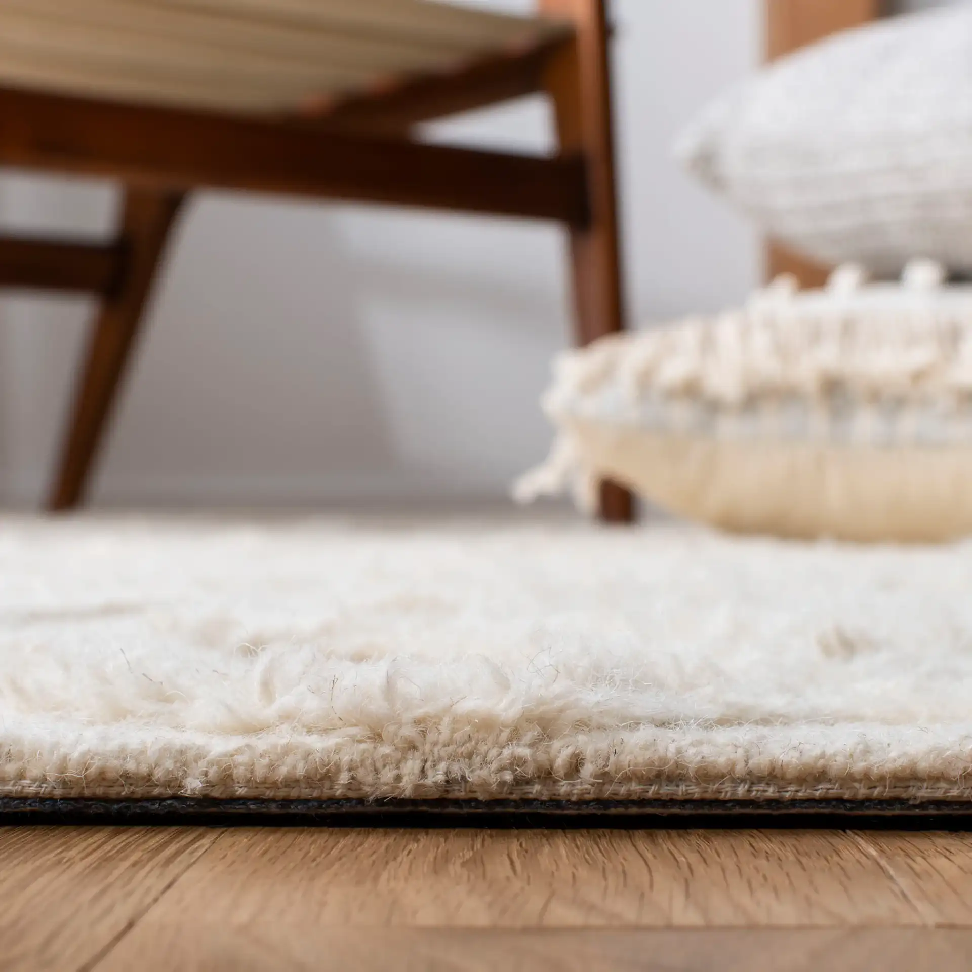 Casablanca Carved Trellis Hand-Tufted Wool Rug in Ivory in a styled room