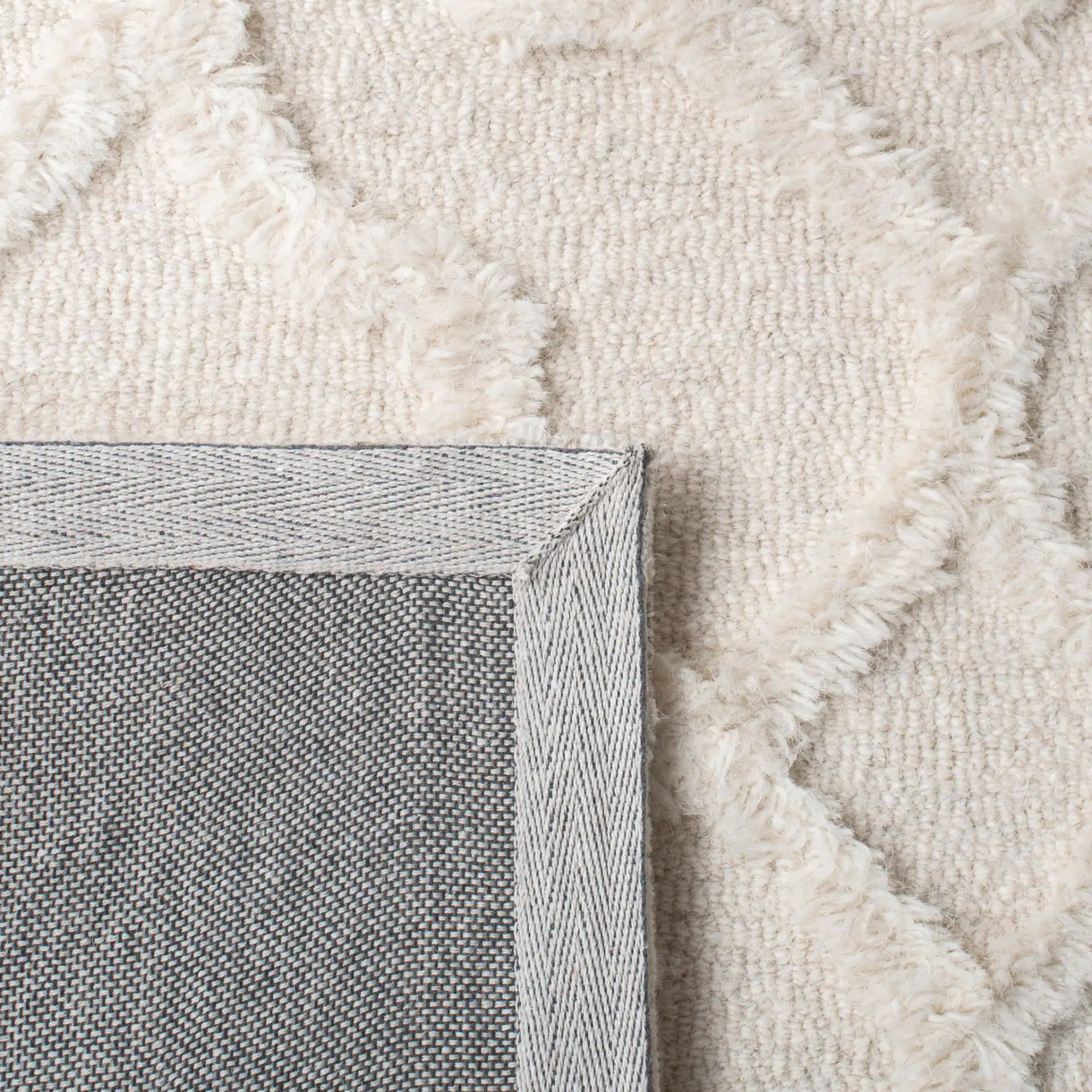 Casablanca Carved Trellis Hand-Tufted Wool Rug in Ivory in a styled room